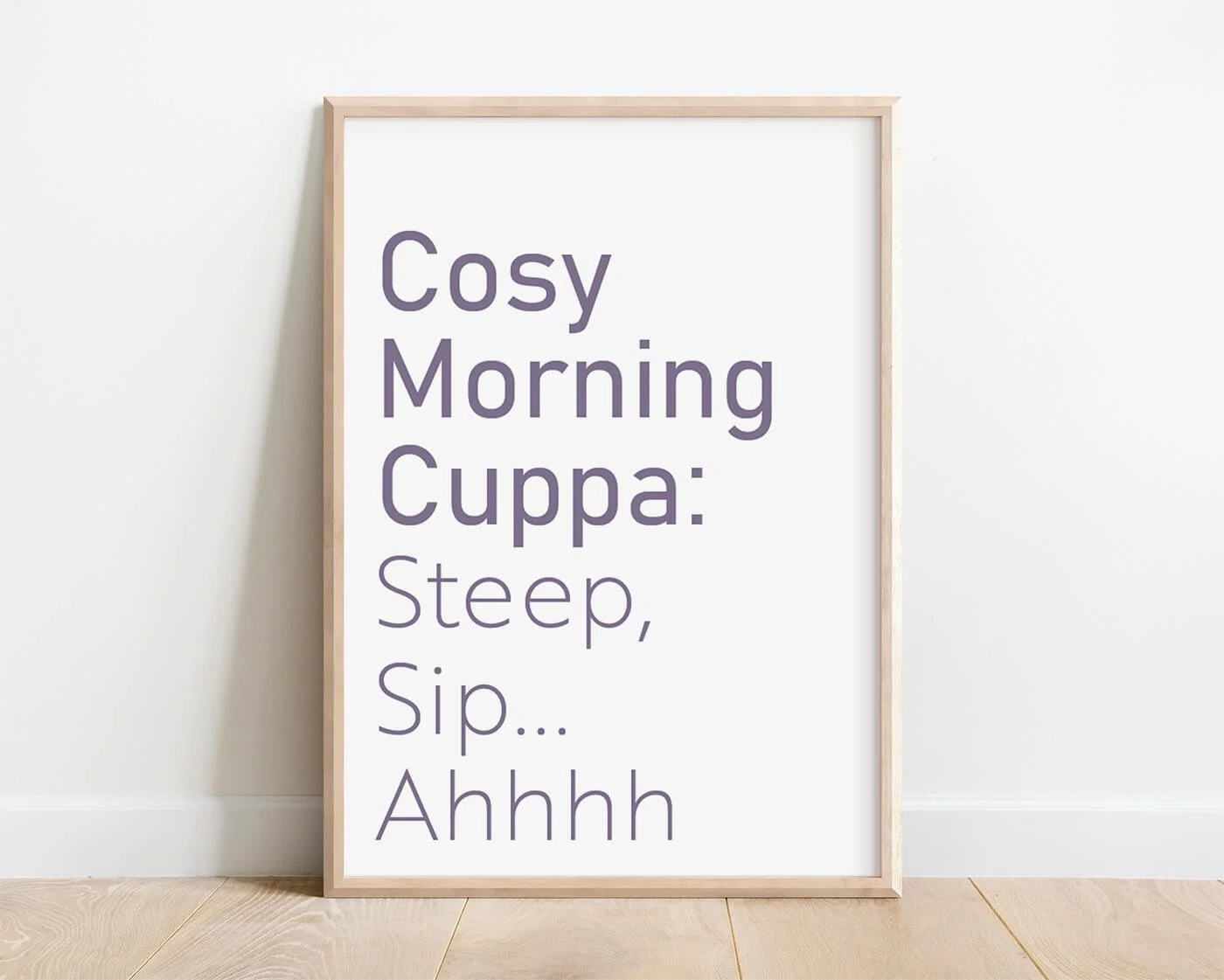 Tea Typography Print in a light wooden frame against a white wall