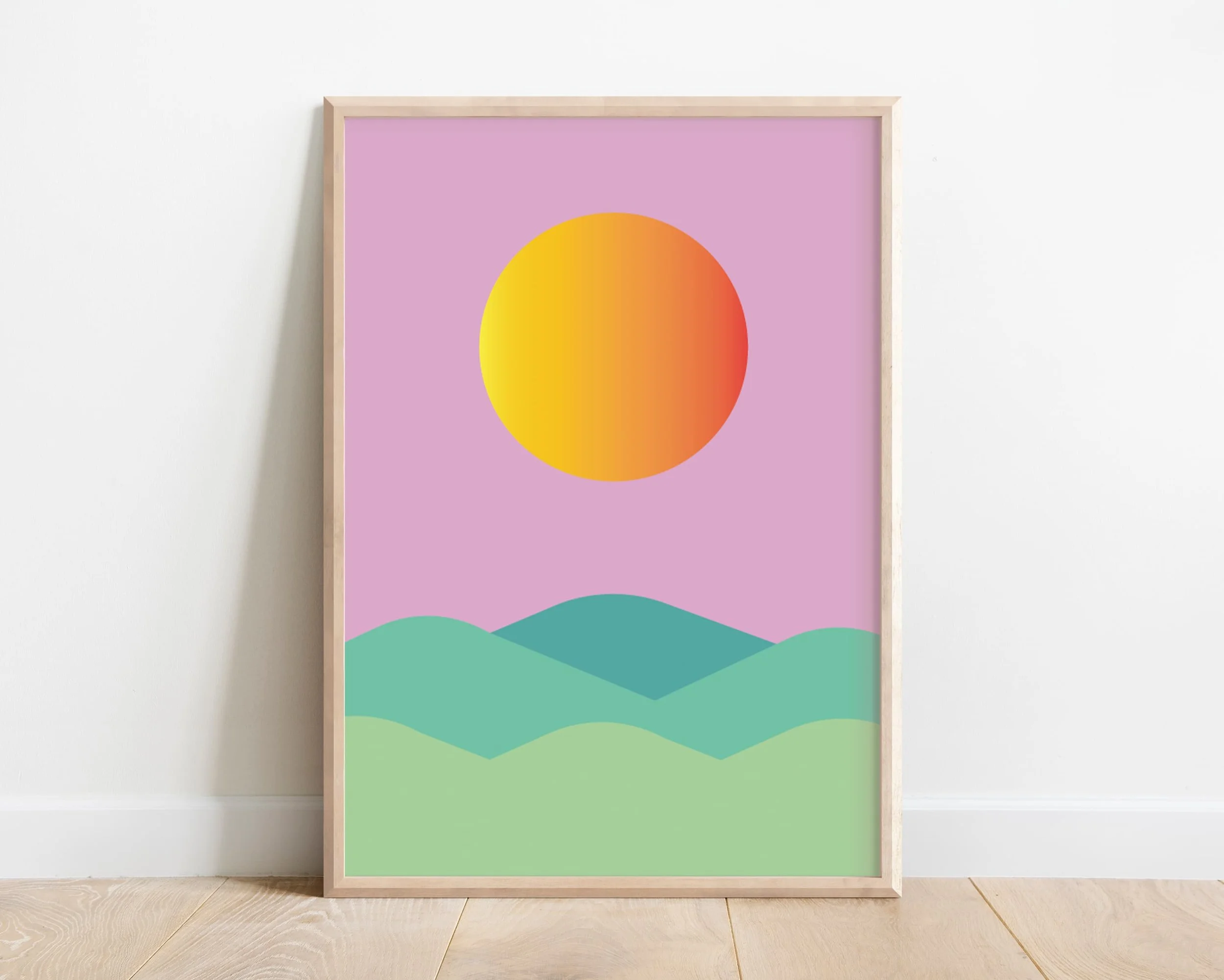 Framed calming nursery wall art print featuring sun and pink hills under a soft sky – ideal for baby girl’s room or gender-neutral decor