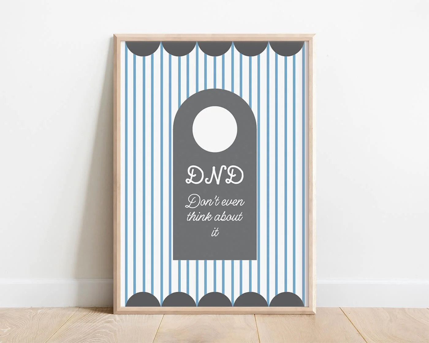 Grey Do Not Disturb Print in a modern wooden frame displayed against a minimalist white wall.