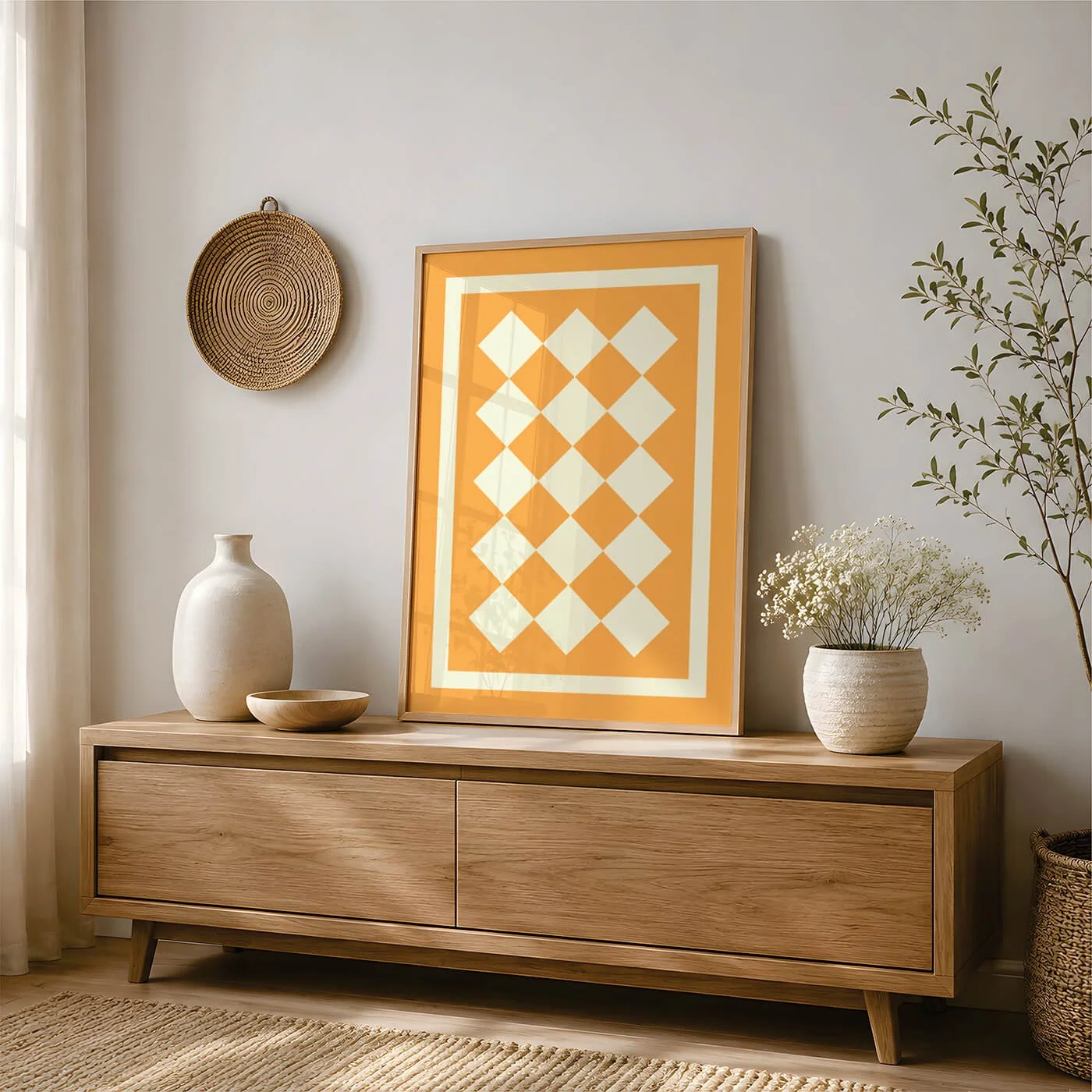 Yellow and cream geometric art print styled on an oak sideboard with neutral home décor