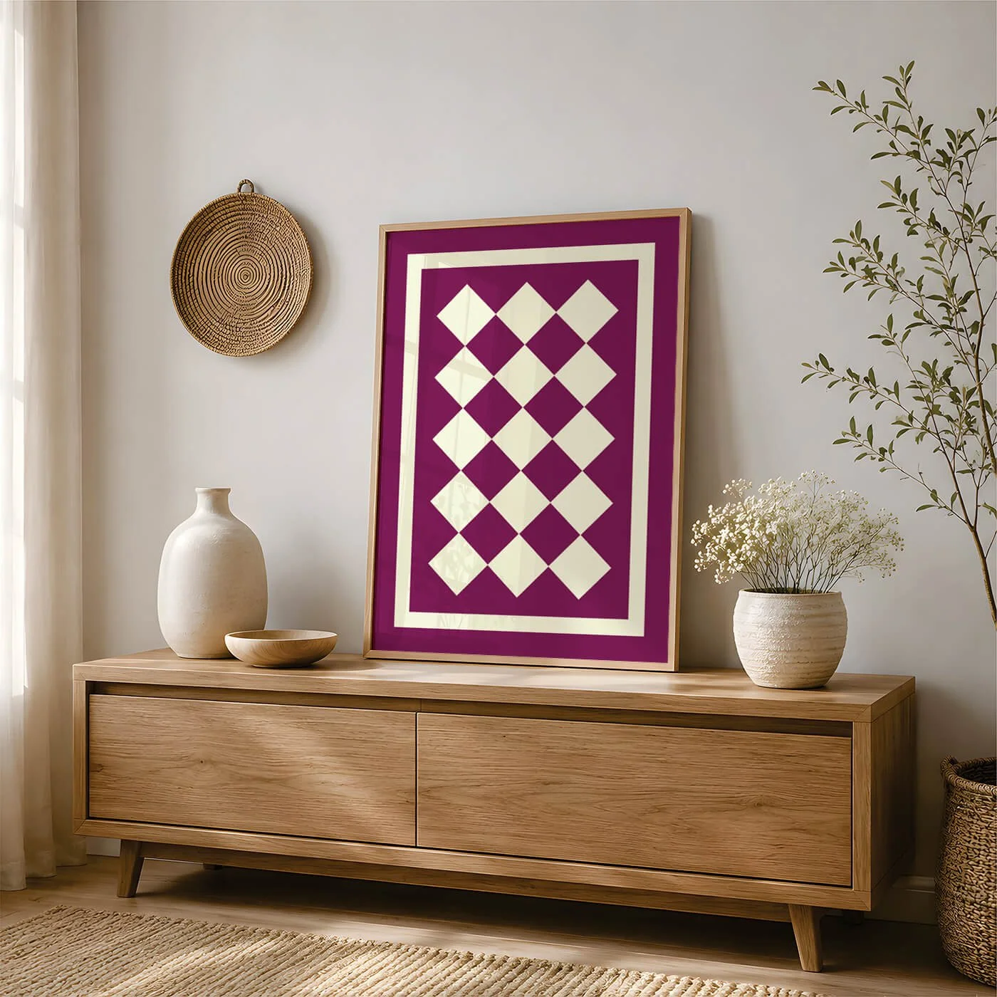 Burgundy and cream geometric art print styled on an oak sideboard with neutral home décor