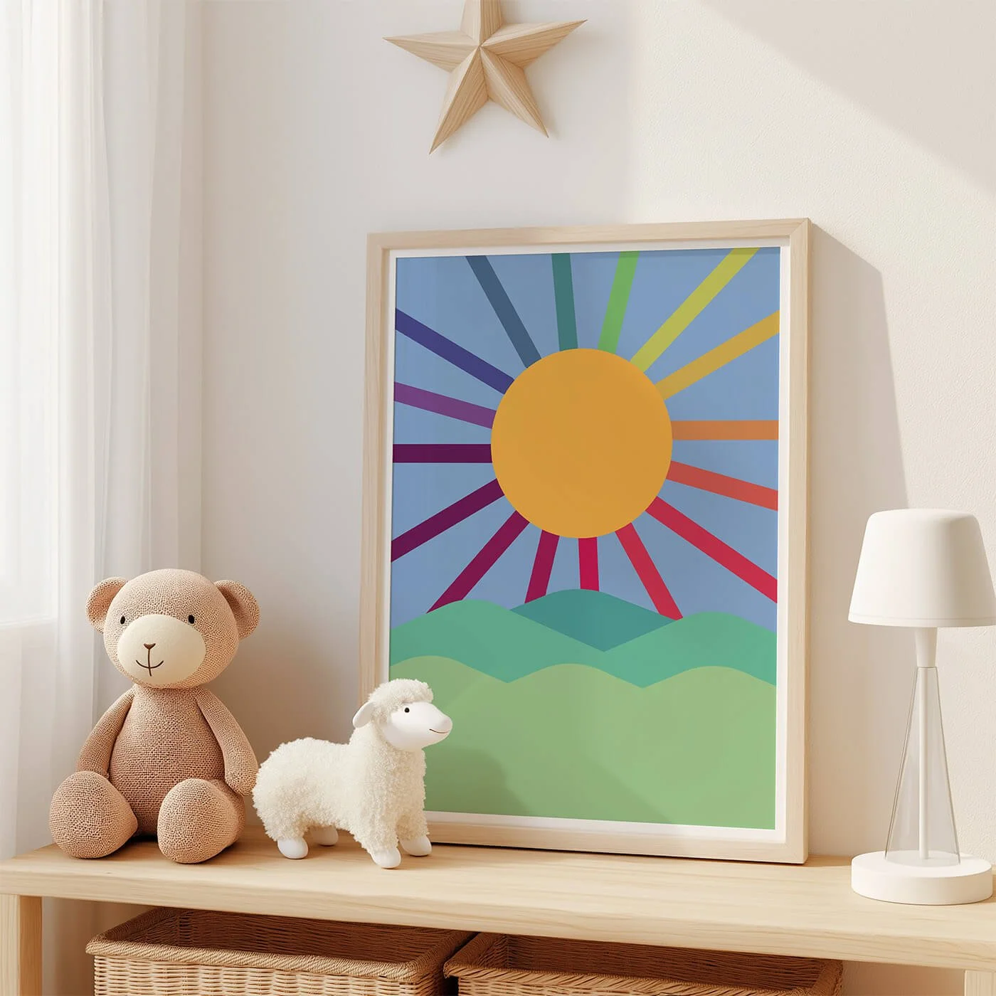 framed rainbow sun print with blue background displayed in childrens room
