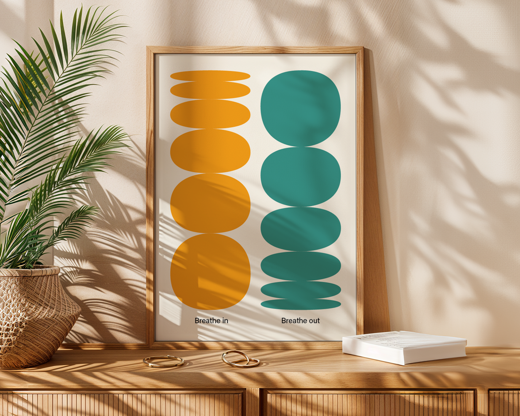 calming poster in frame next to palm plant