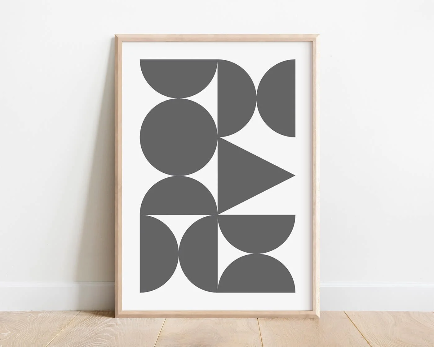 Grey Abstract Forms Print shown in a natural wooden frame against a clean white background.