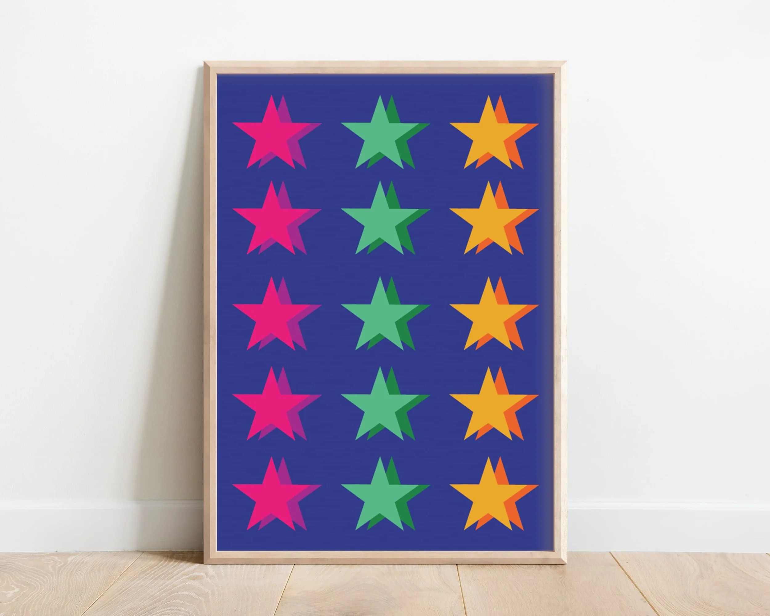 Framed colourful stars wall art in blue and multicolour tones, modern illustration style, displayed against white interior wall