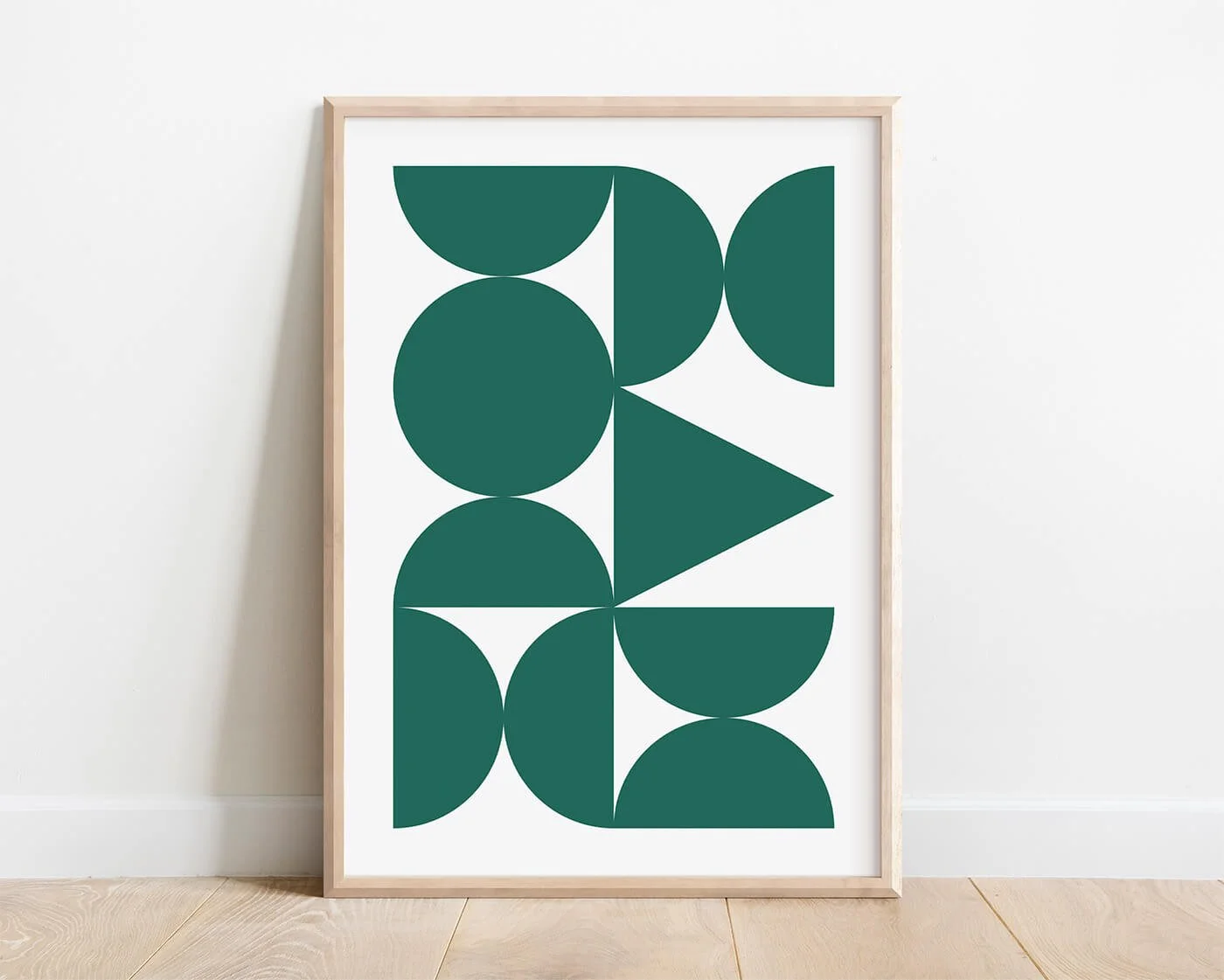 Green Abstract Forms Print in a modern wooden frame against a white background.