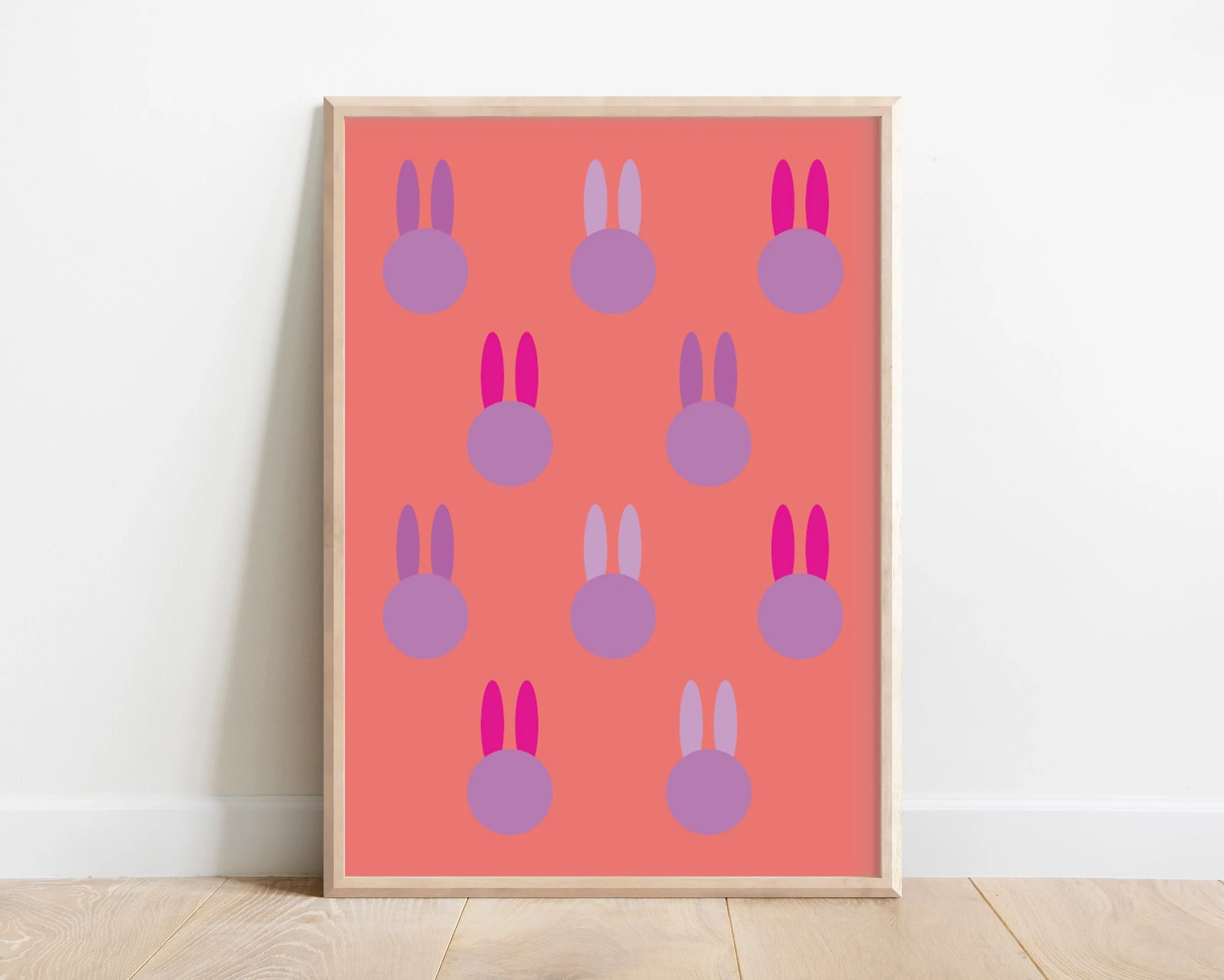 Framed colorful bunny art print in coral and purple tones – playful wall decor for nursery or kids' room