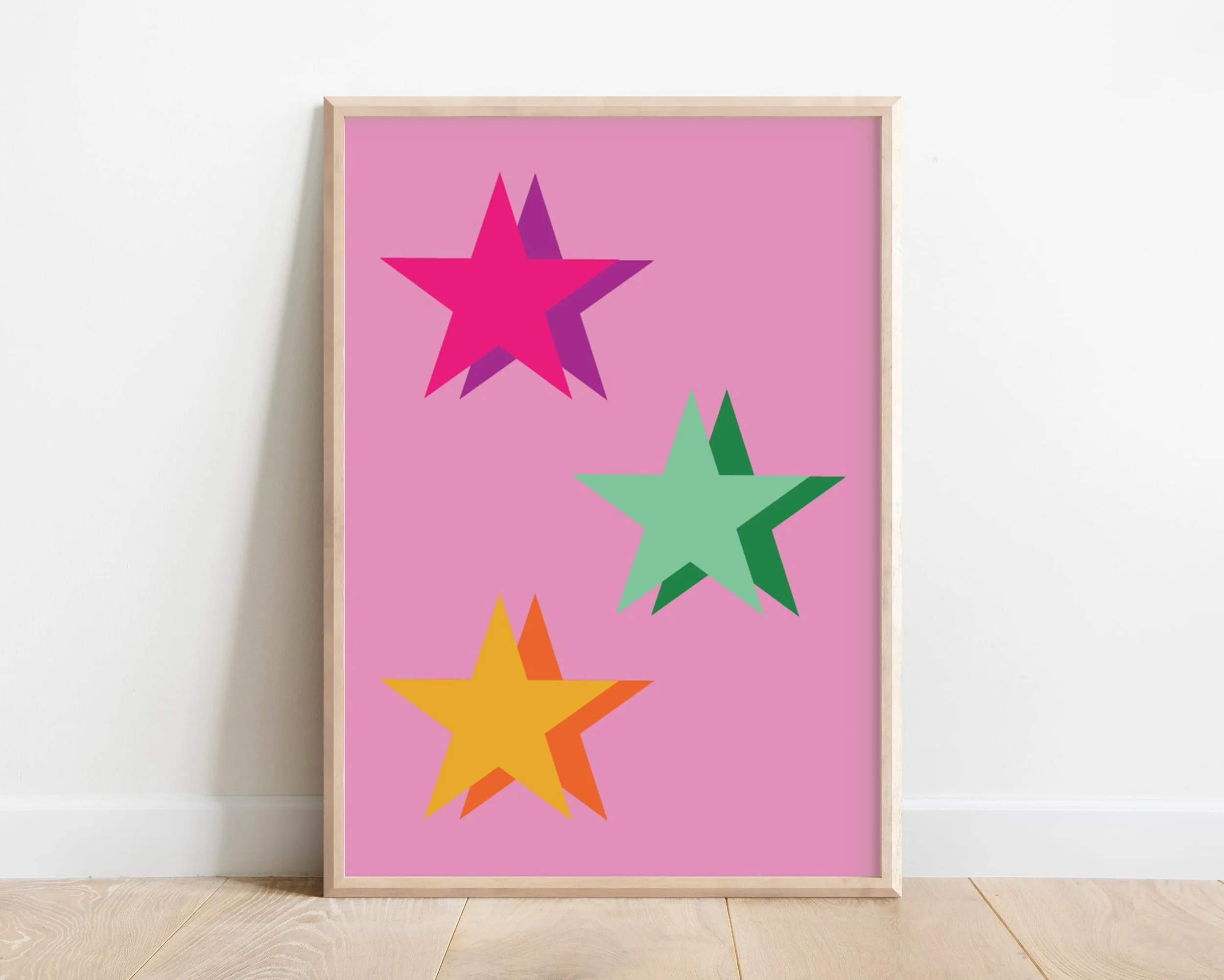 Colourful kids wall art with a large green star and smaller pink and yellow stars on a pink background, perfect for girls' room decor