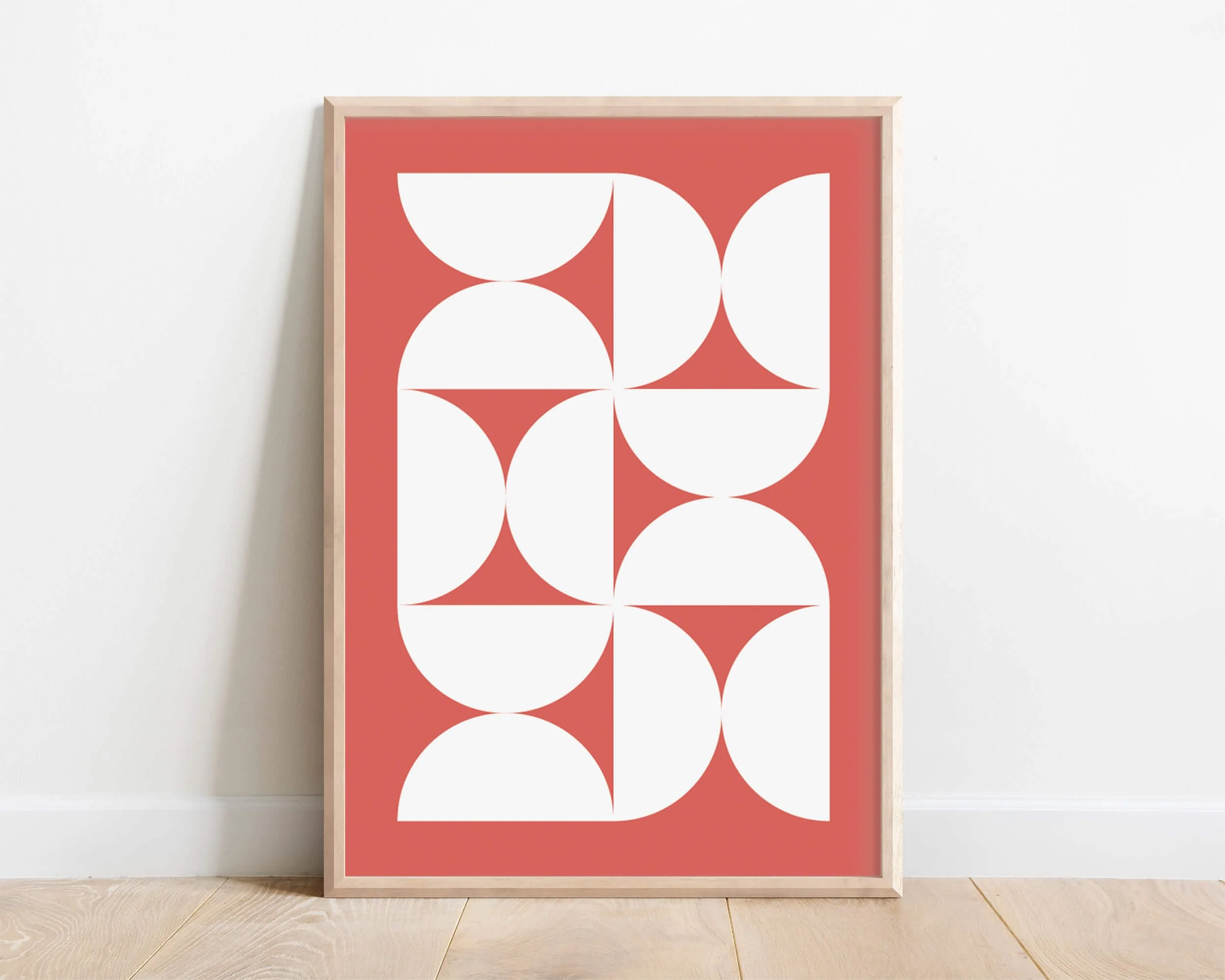 Framed modern bauhaus poster with geometric shapes in white and coral hues