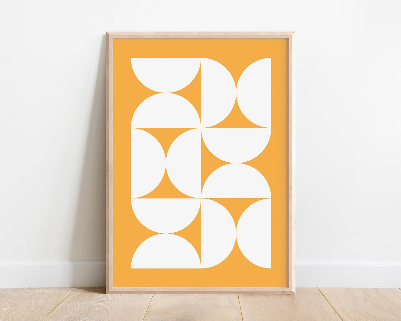 framed abstract print of bauhaus style shapes in yellow tones