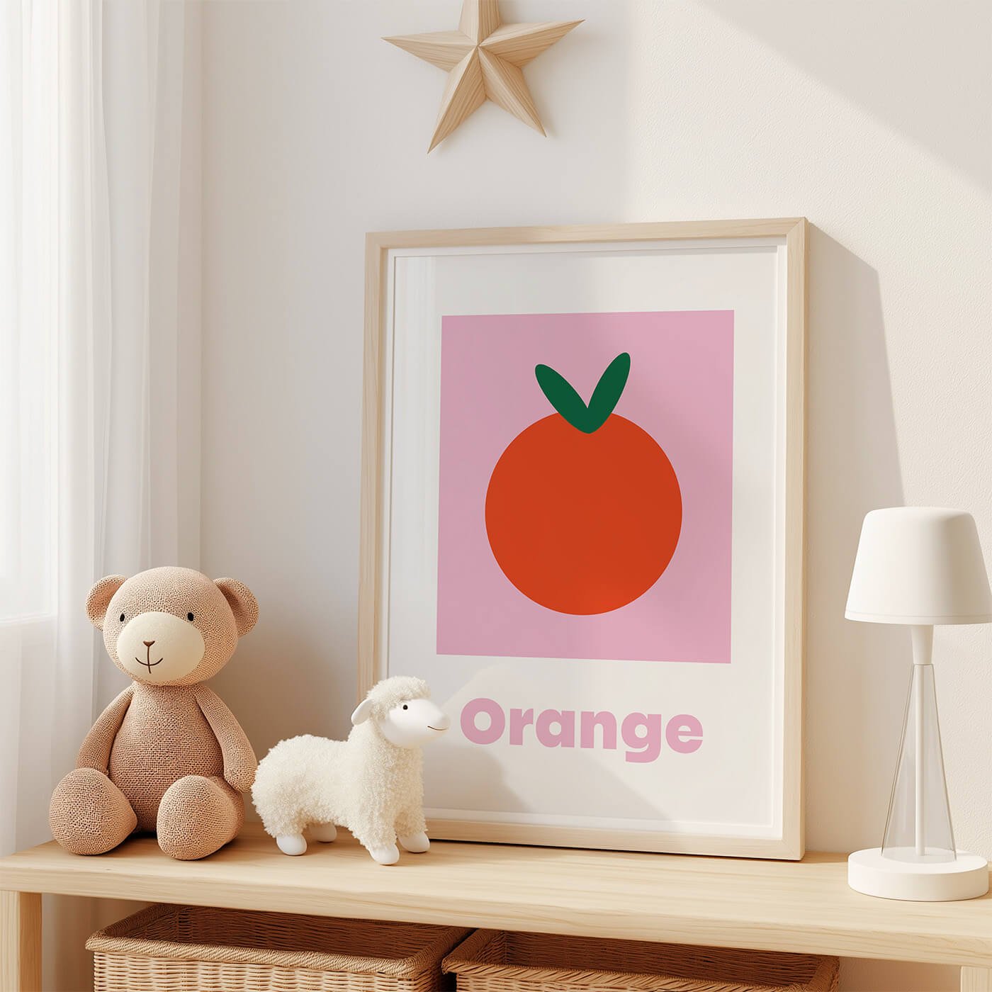 Orange learning print displayed in modern frame on a contemporary shelf in kids room next to two stuffed teddies