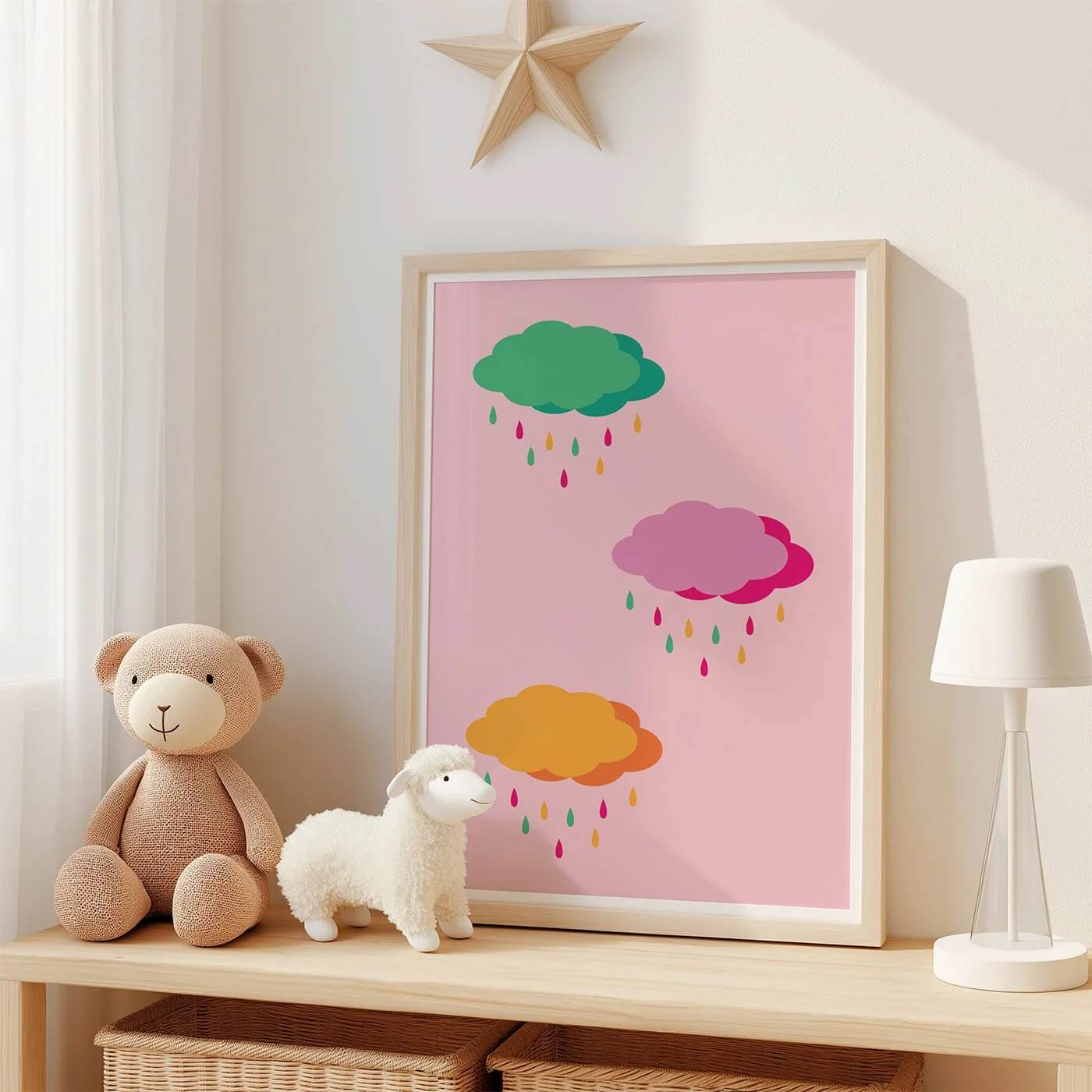 Pink rainbow clouds poster for kids displayed on wooden shelf in colourful childrens room
