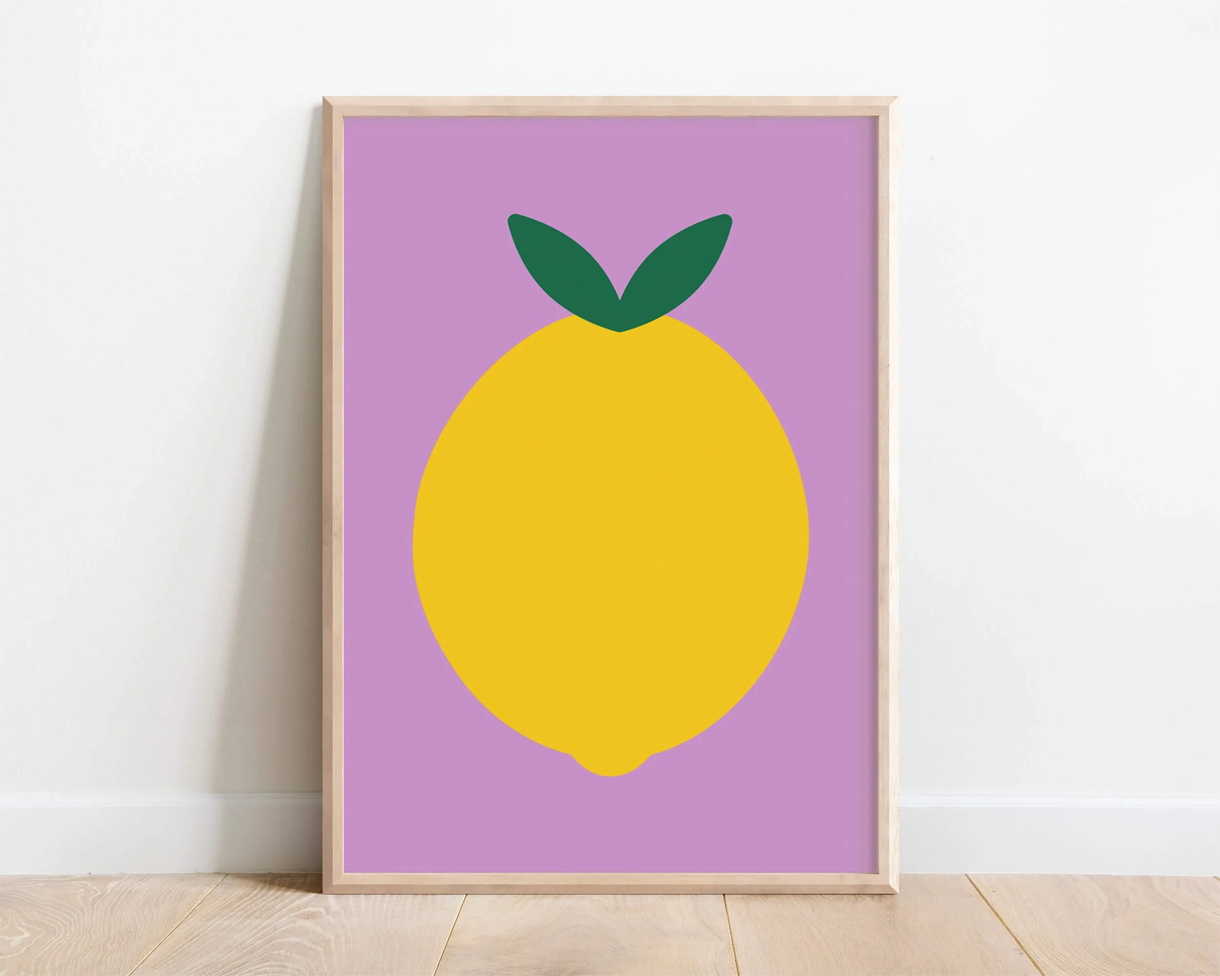 framed lemon poster displayed on interior white wall
