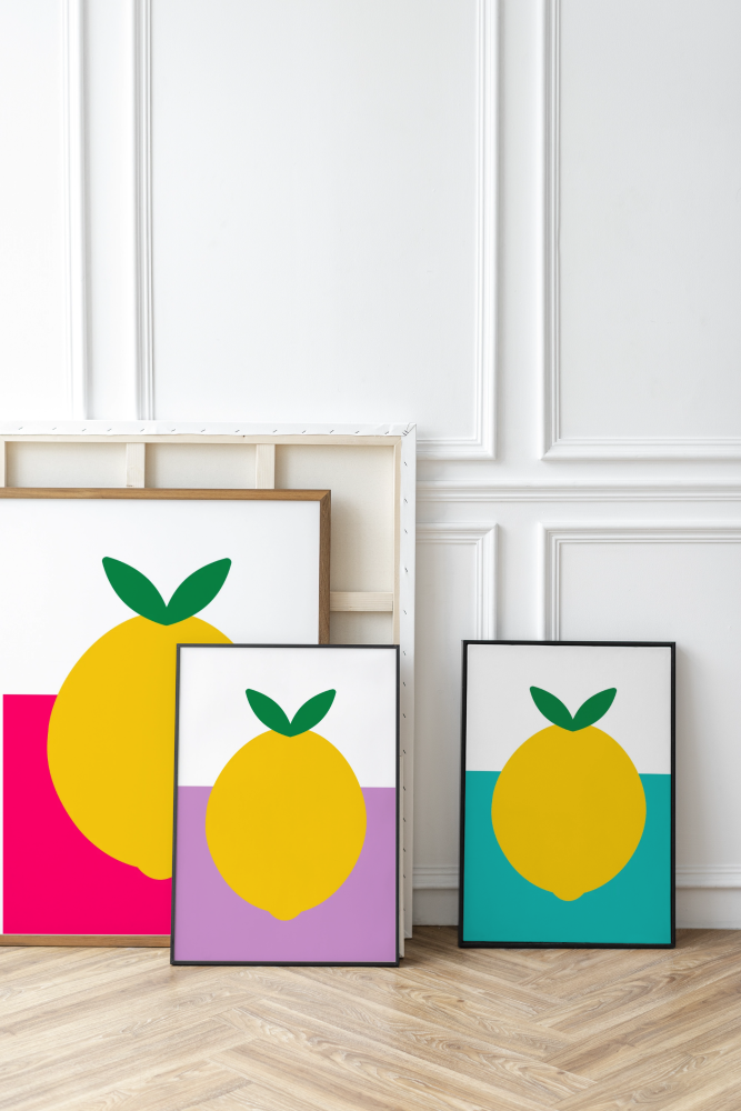 colourful prints of lemons resting against wall