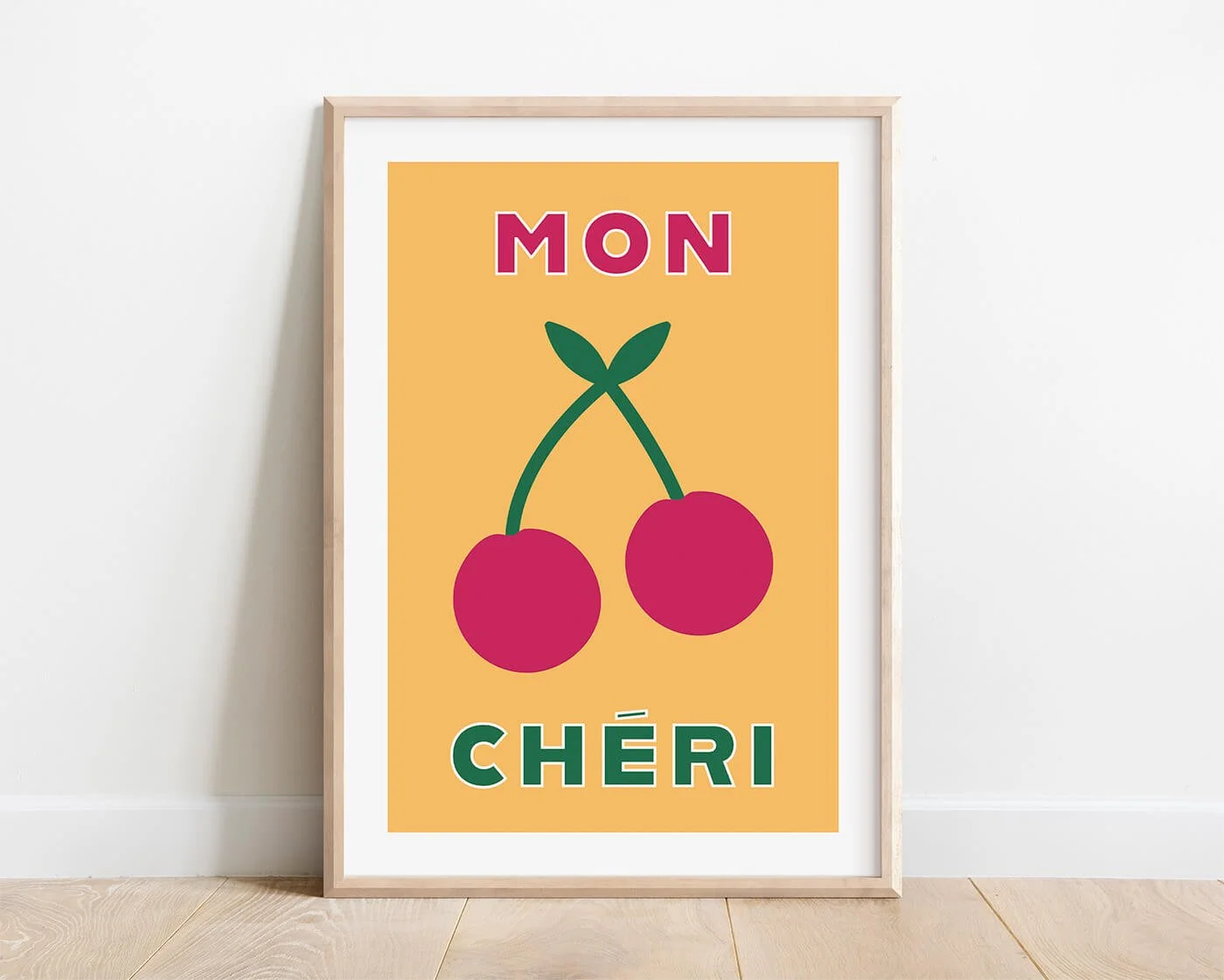 Yellow Mon Cheri retro style art print in a wooden frame mounted on a bright white wall by Amatus