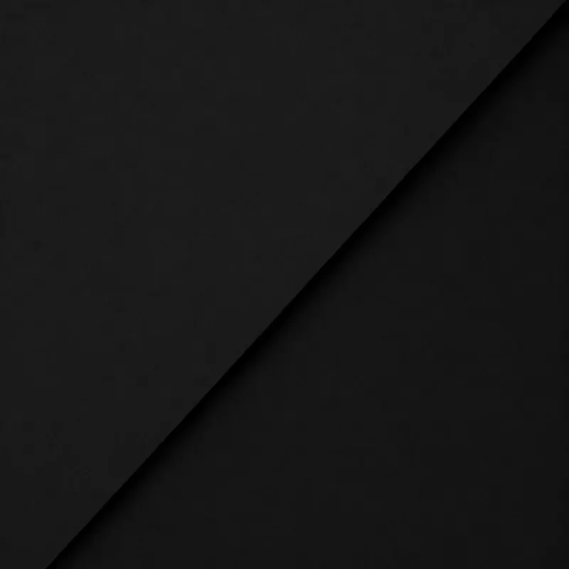 Solid black background with a slight diagonal shadow or fold.