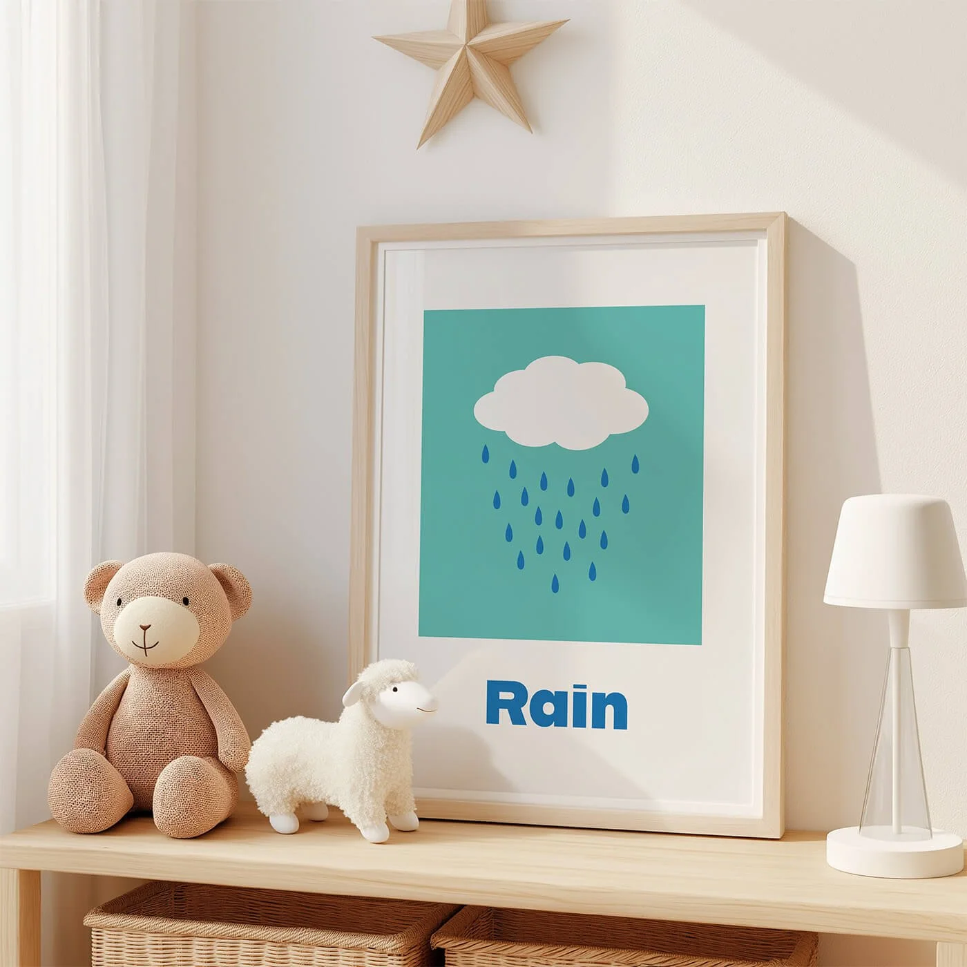 Modern rain educational playroom print for early word association, displayed in a frame on a shelf alongside two cuddly plush toys