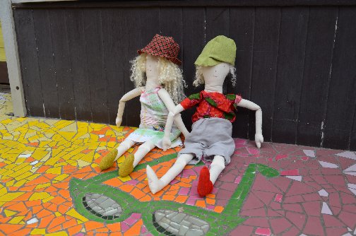 and sat on the colourful pavement mosaic