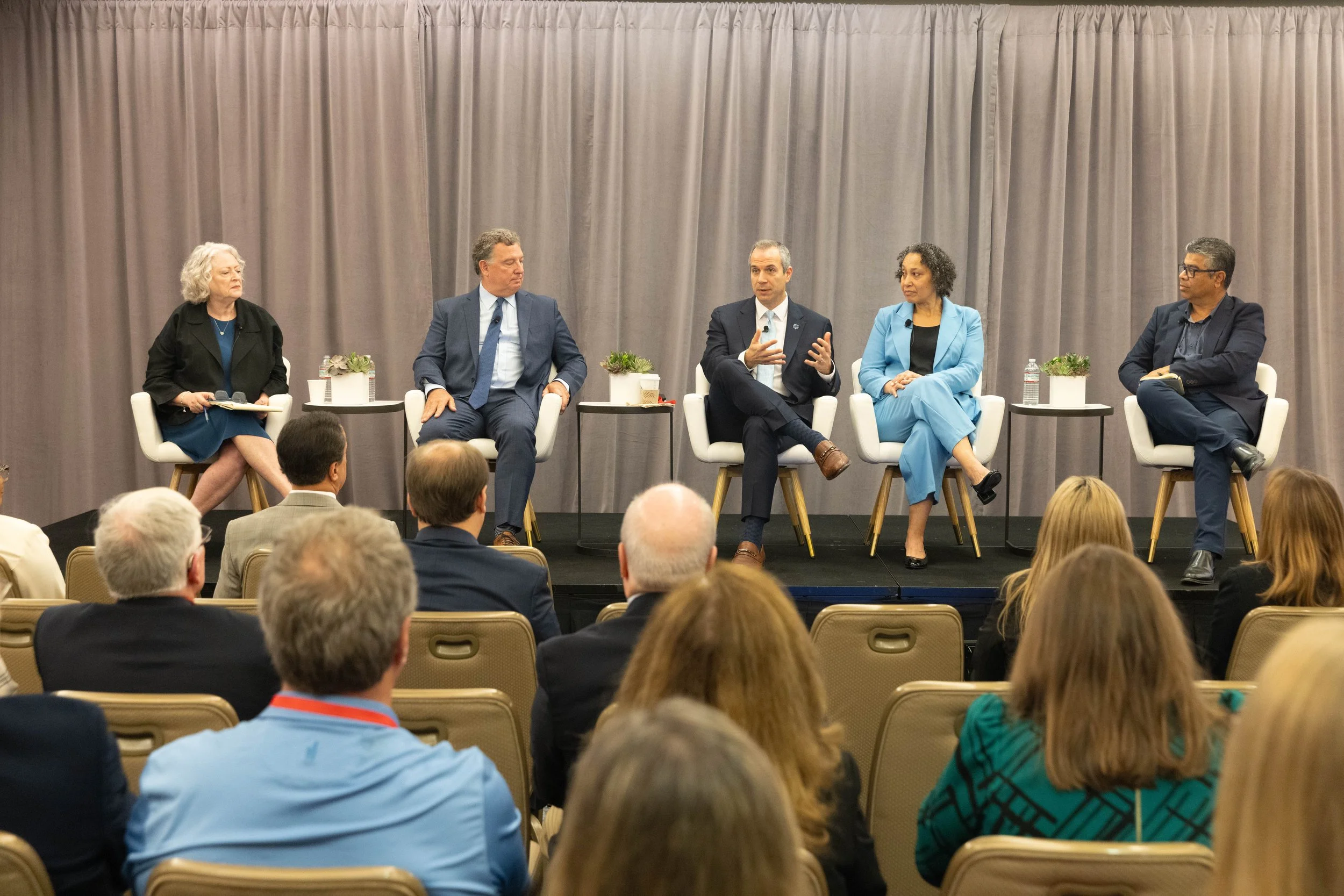 Dr. Zara Cooper and Dr. Zia Agha listen intently during a fireside chat at the AHA's 2025 annual membership meeting.
