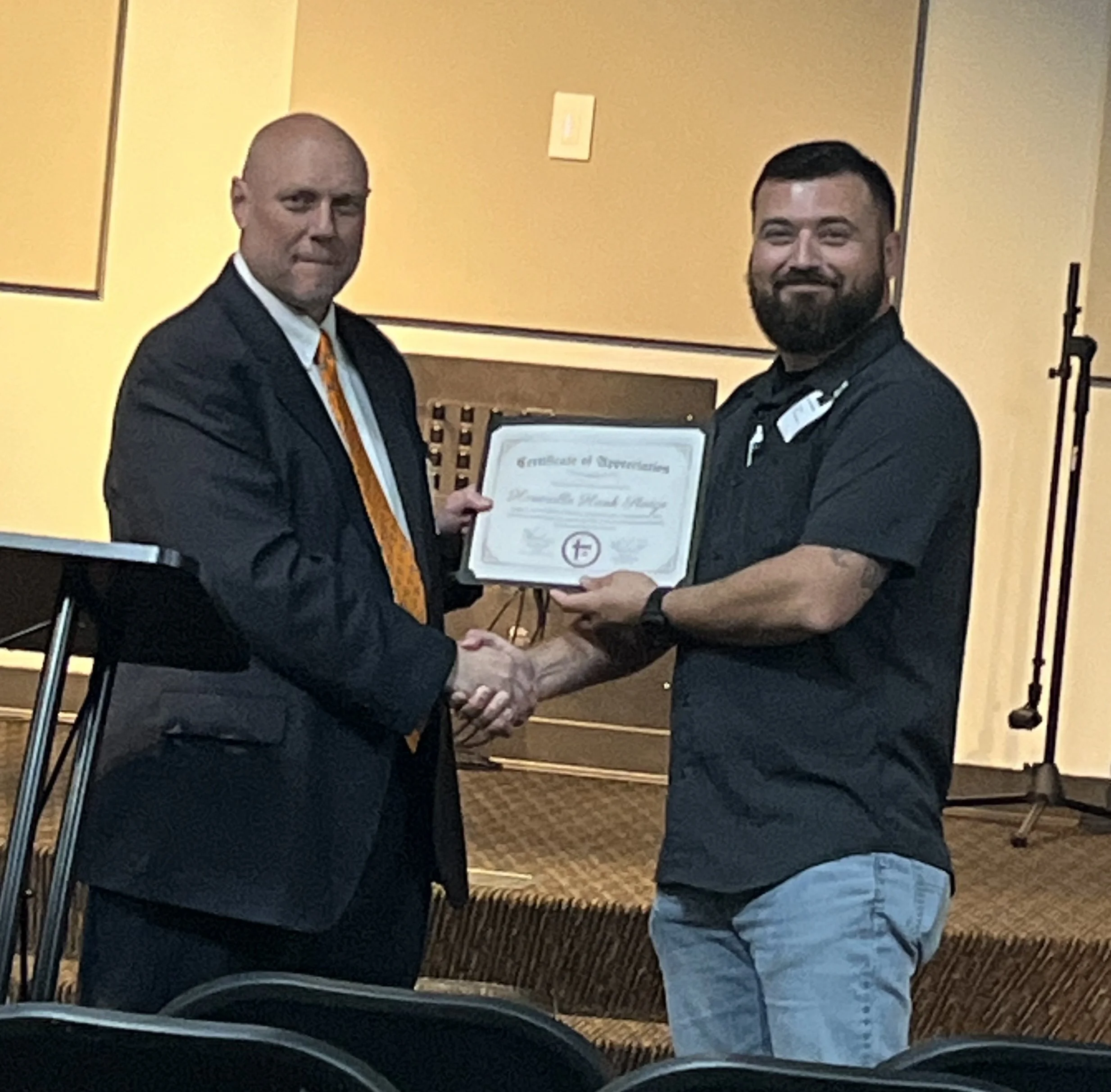 Judge Hank Sledge receives a certificate of appreciation