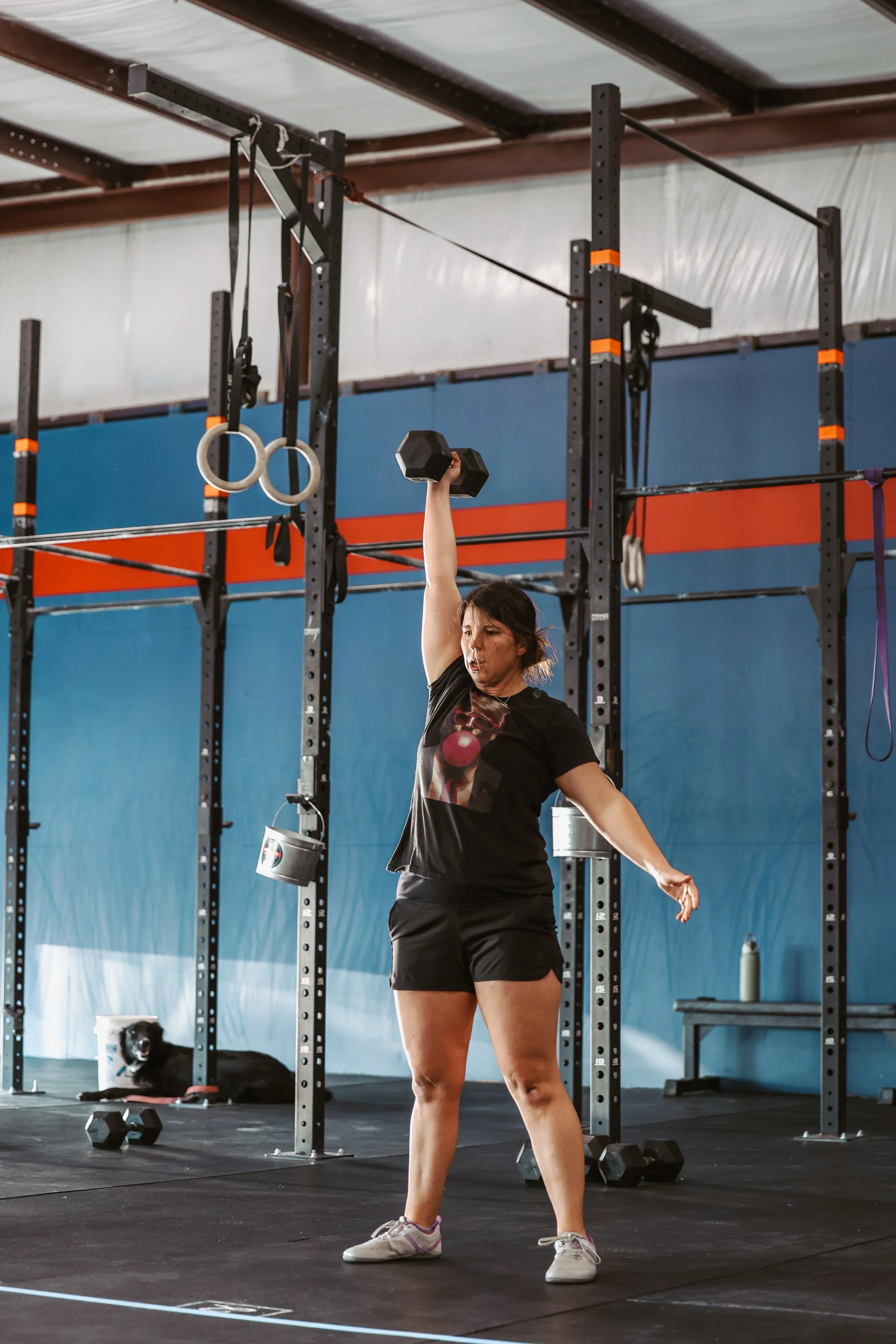 Woman strength training with a dumbbell at Einhorn Training Co. in New Braunfels, TX