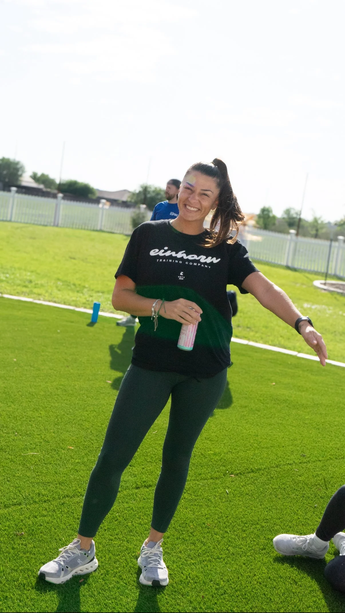 Smiling Einhorn Training Co. coach at an outdoor community workout in New Braunfels, TX