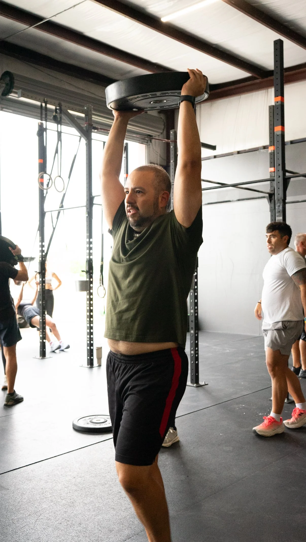 Member doing a pull-up at Einhorn Training Co., a functional fitness gym in New Braunfels, TX