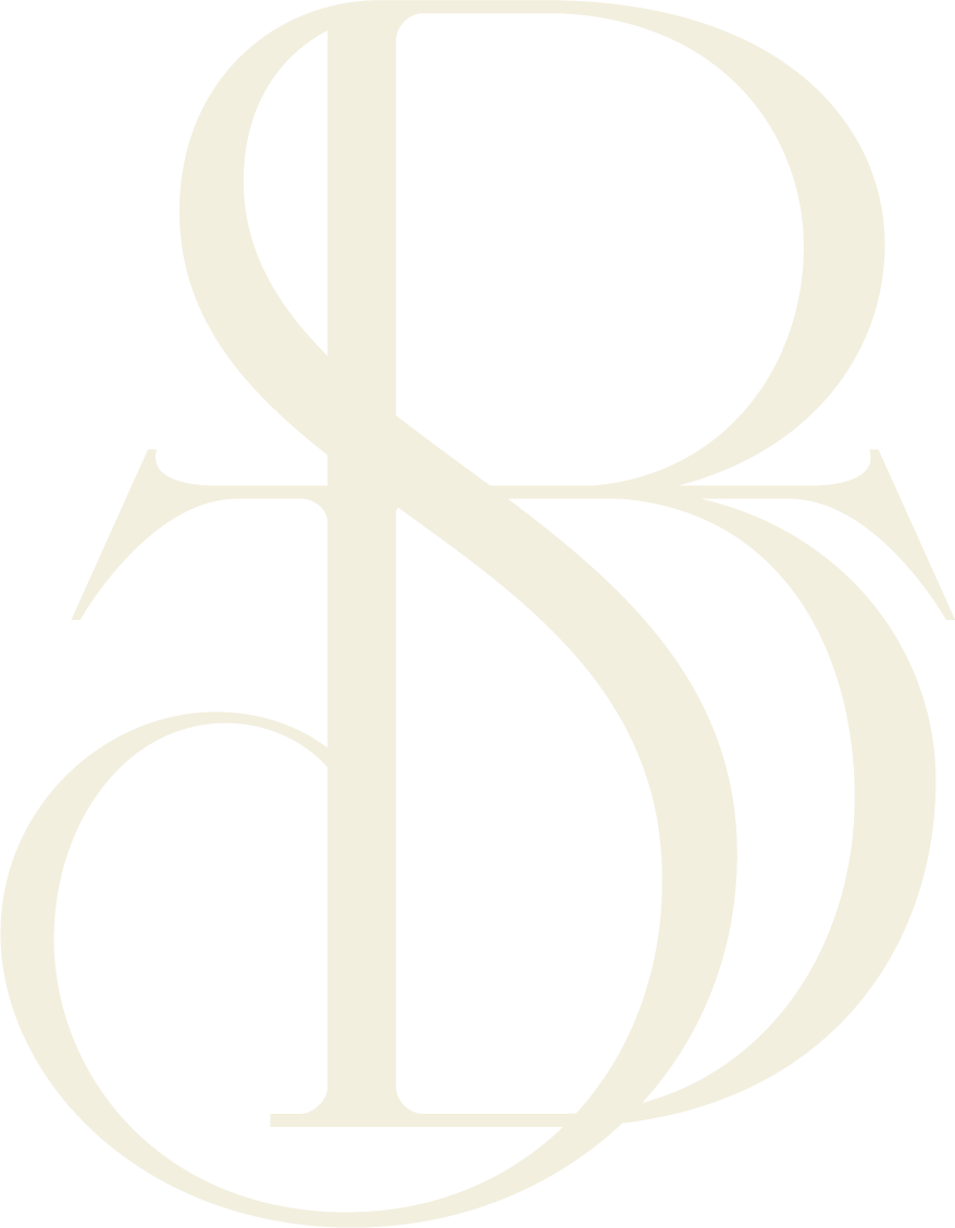 Large, stylized letter 'BTS' in a light, beige color.
