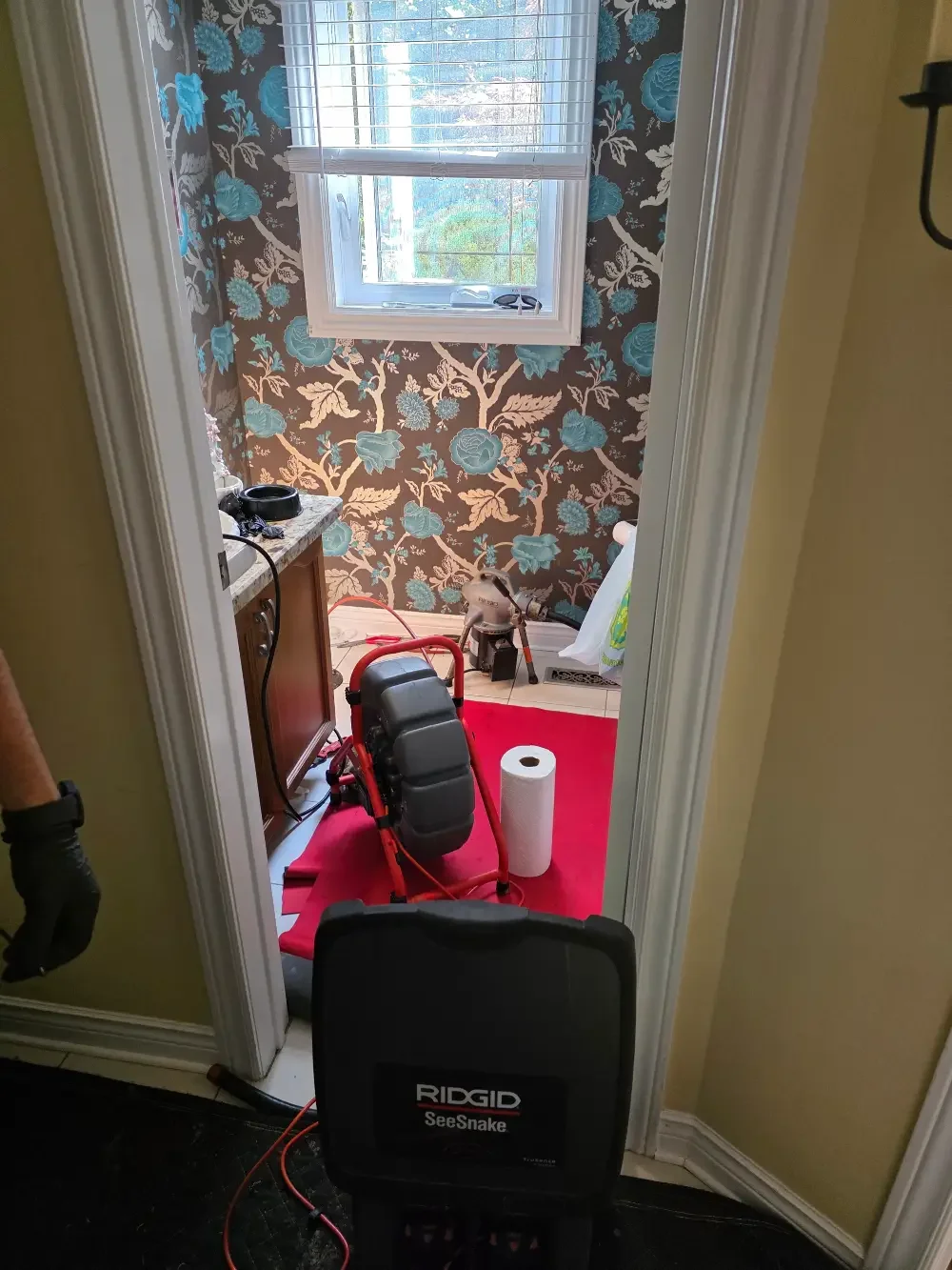Professional drain camera inspection and drain snaking equipment used to diagnose and clear a residential drain in Springwater, Ontario