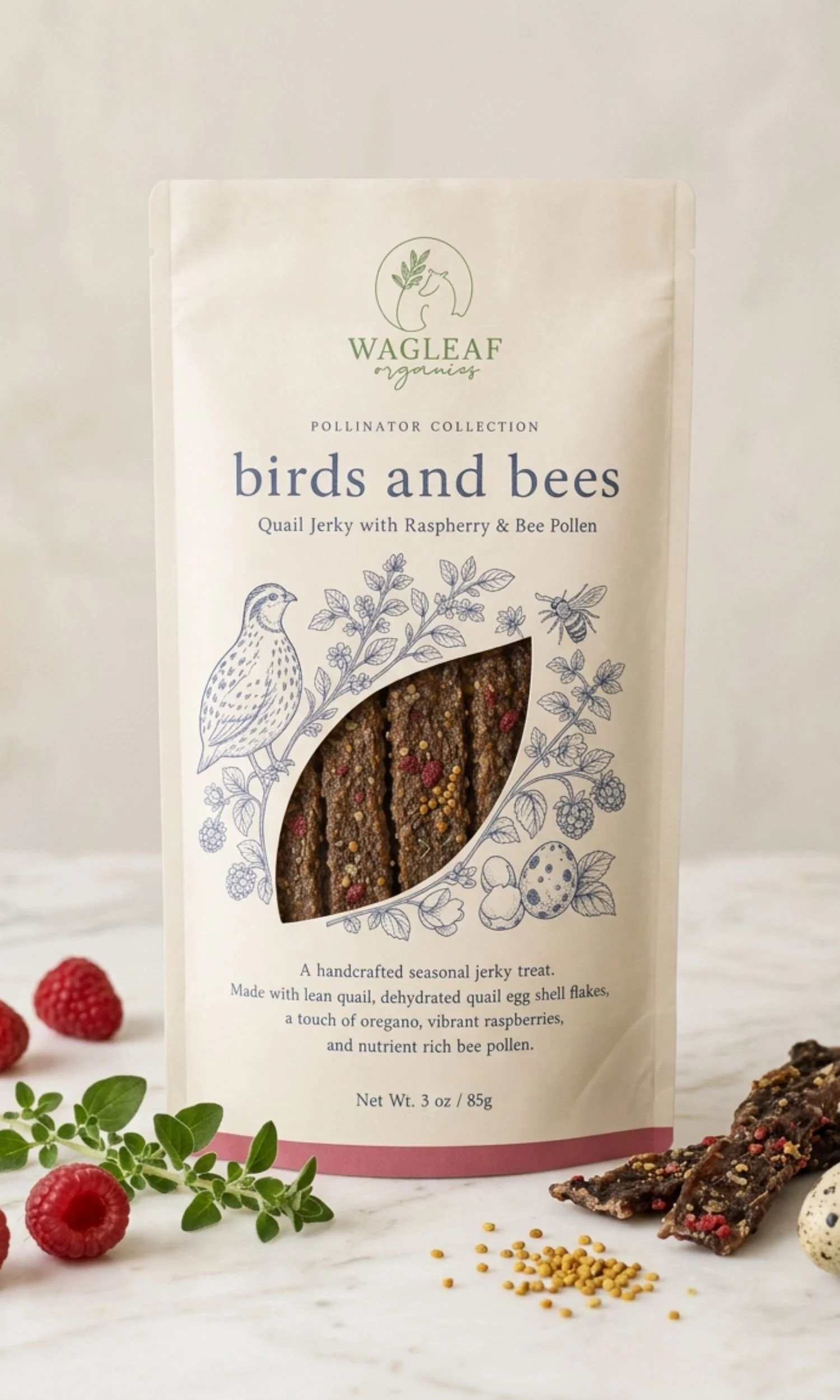 Packaging of WAGLEAF Organics pollinator collection, 3 oz. of handcrafted quail jerky with raspberries and bee pollen, surrounded by fresh raspberries, herbs, and jerky strips.