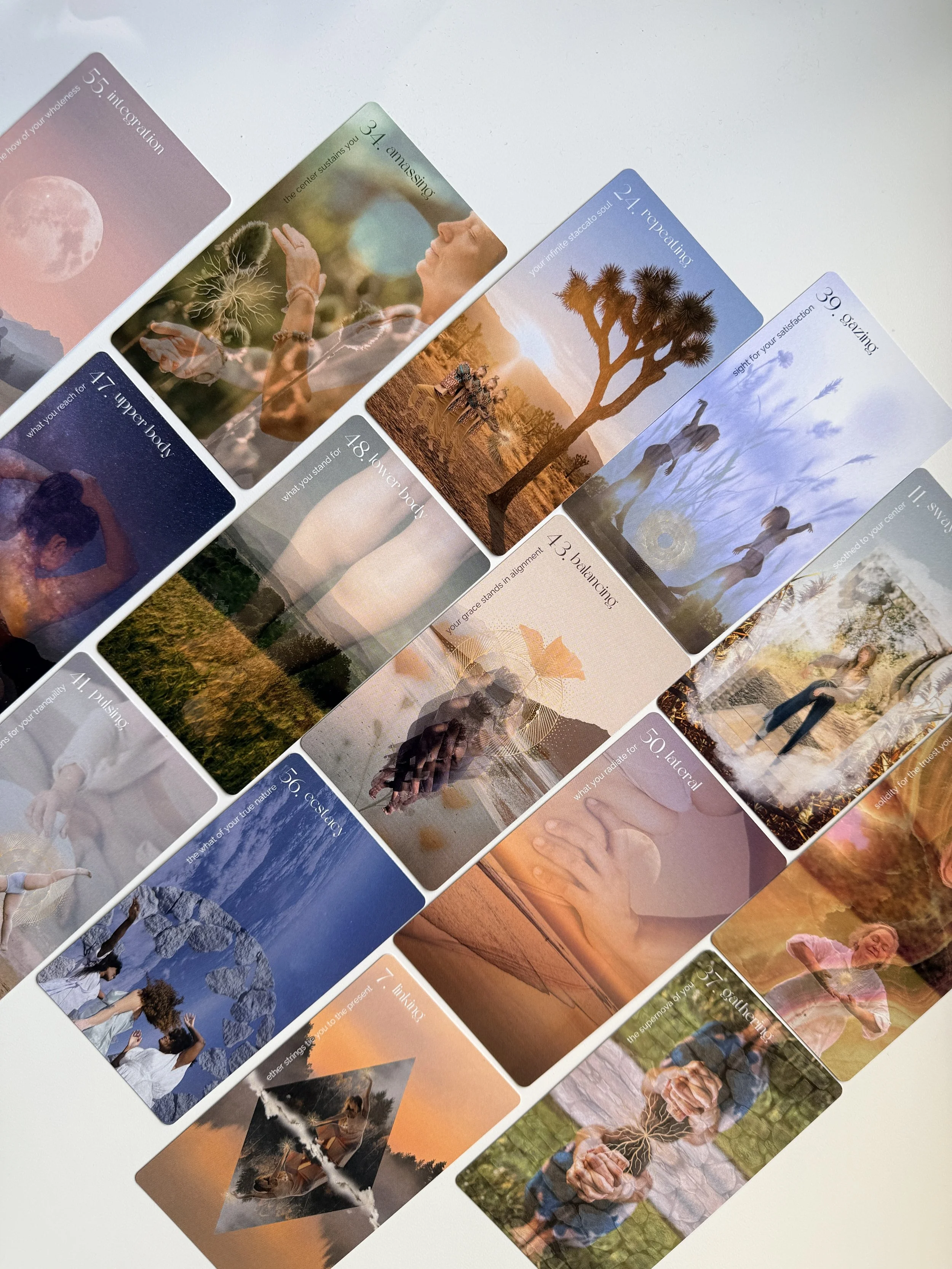 A collection of colorful oracle cards featuring various images such as a moon, woman with tree roots, desert landscape with a tree, a girl with flowers, and a woman with hands in a heart shape connected to a tree. The cards contain guiding text about emotions, body, nature, and spirituality.
