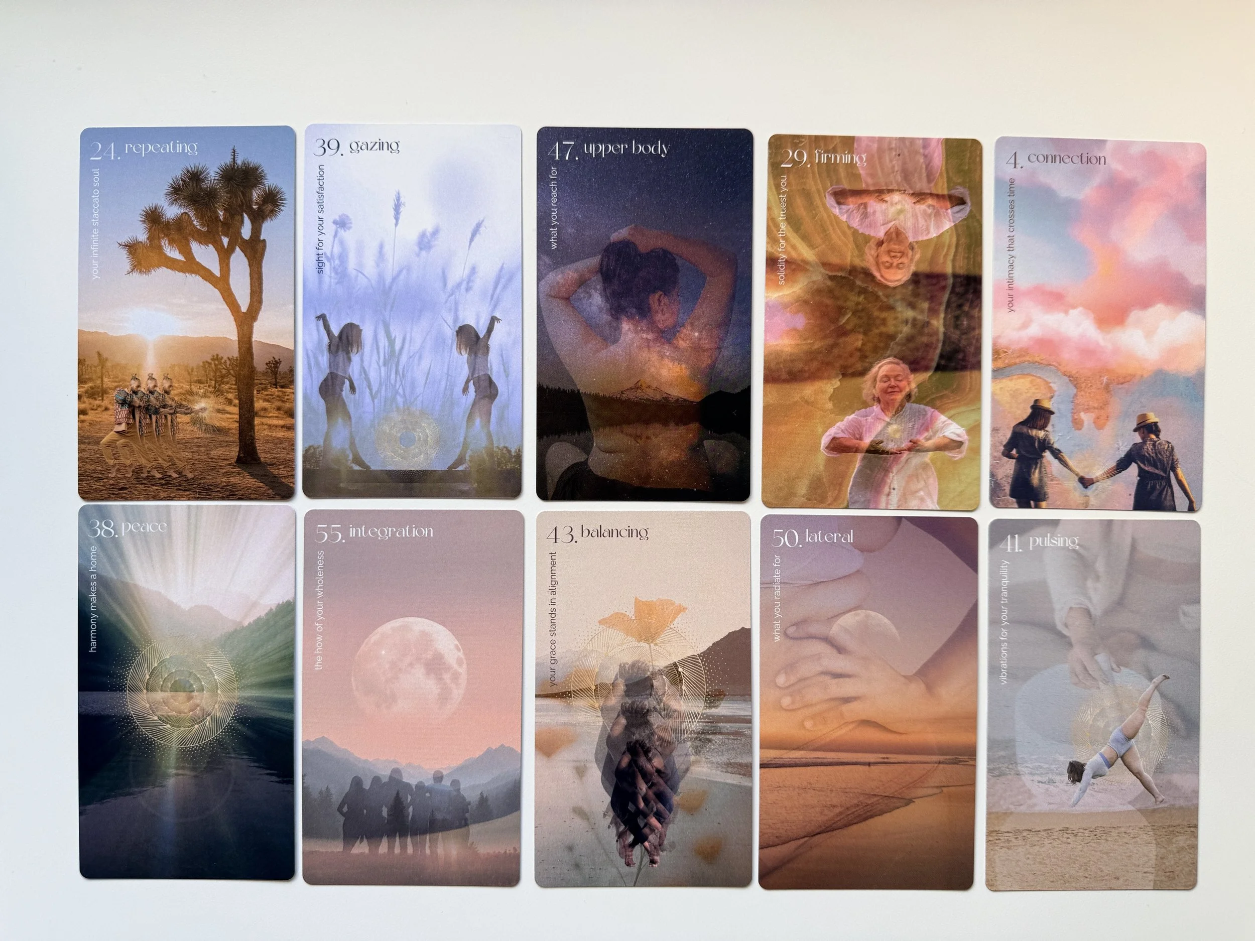 A series of colorful affirmation cards featuring images of nature, people, and spiritual scenes, each with a positive message such as 'your infinite stellar soul,' 'sight for your satisfaction,' 'what you reach for,' 'solidarity for the finest you,' and 'your intimacy that crosses time.'