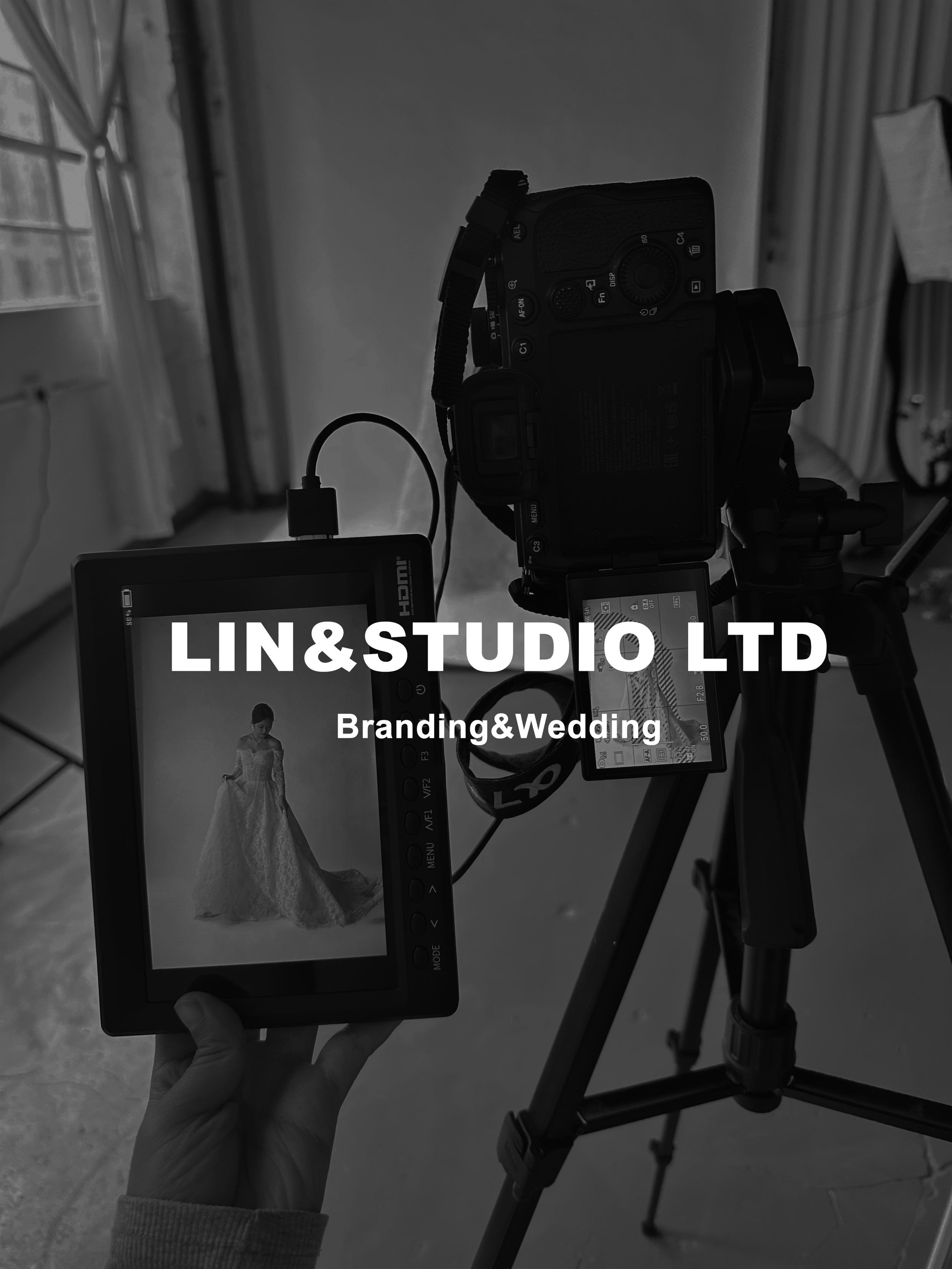 Black and white image of a camera mounted on a tripod, with a monitor showing a bride in a wedding gown, indicating a wedding or bridal photography setting, with overlaid text 'LIN&STUDIO LTD Branding&Wedding'.