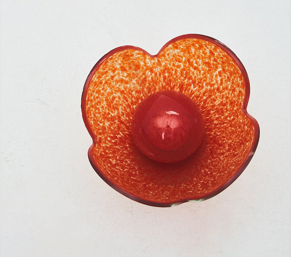 The red sculptural flower-shaped glass Lucky Akebia Desk Lamp captured from above.