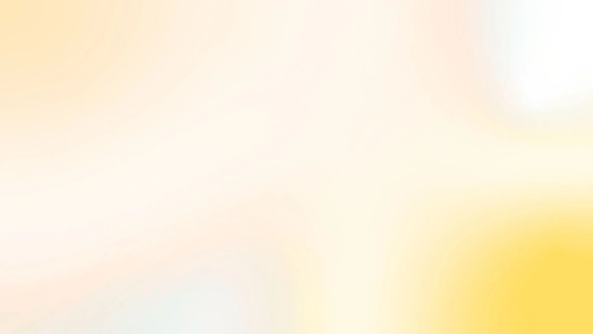 The image is blurry with pastel colors making it difficult to identify specific objects or details.