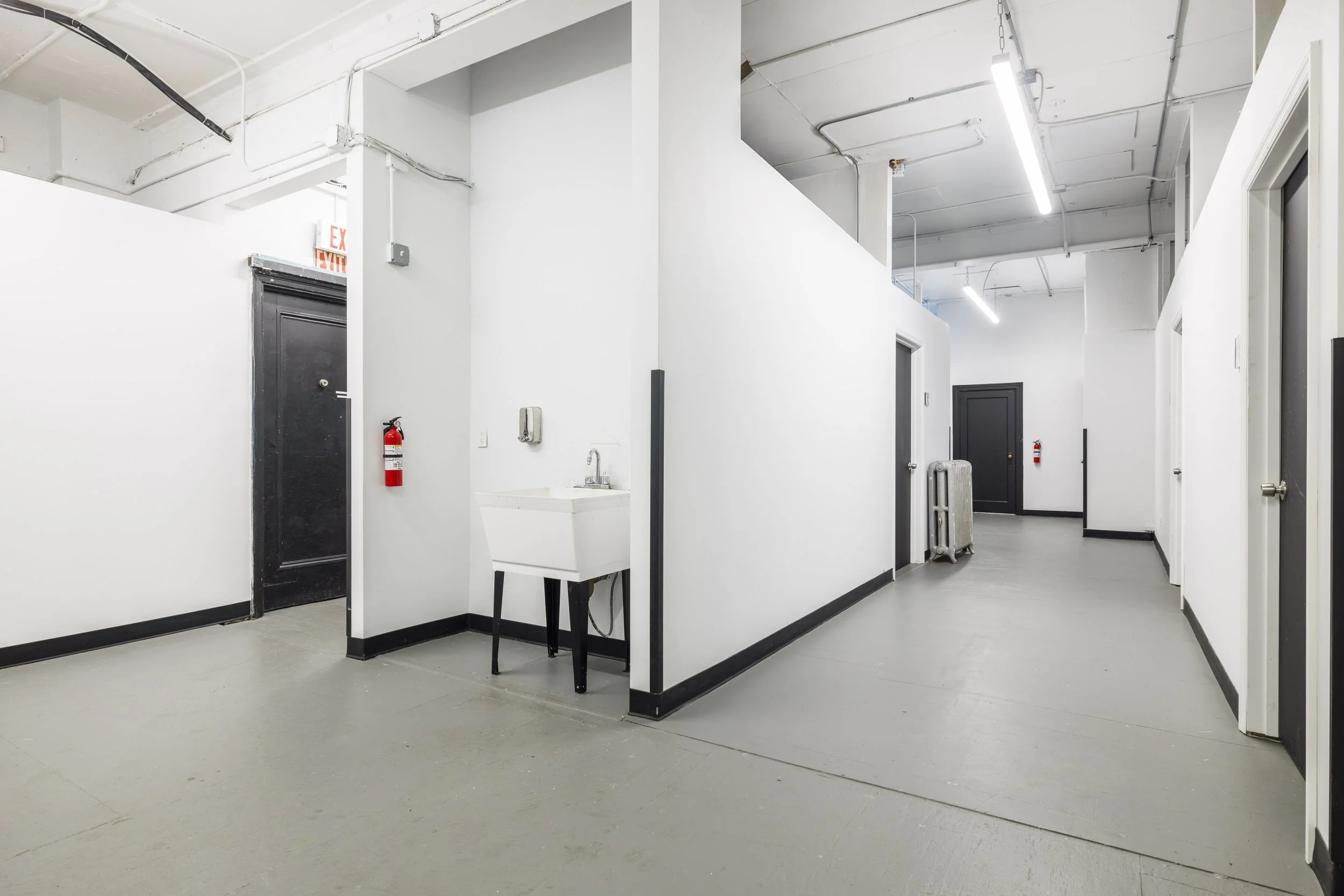 Hallway with private studio doors at 126 41st Street, Sunset Park, Brooklyn