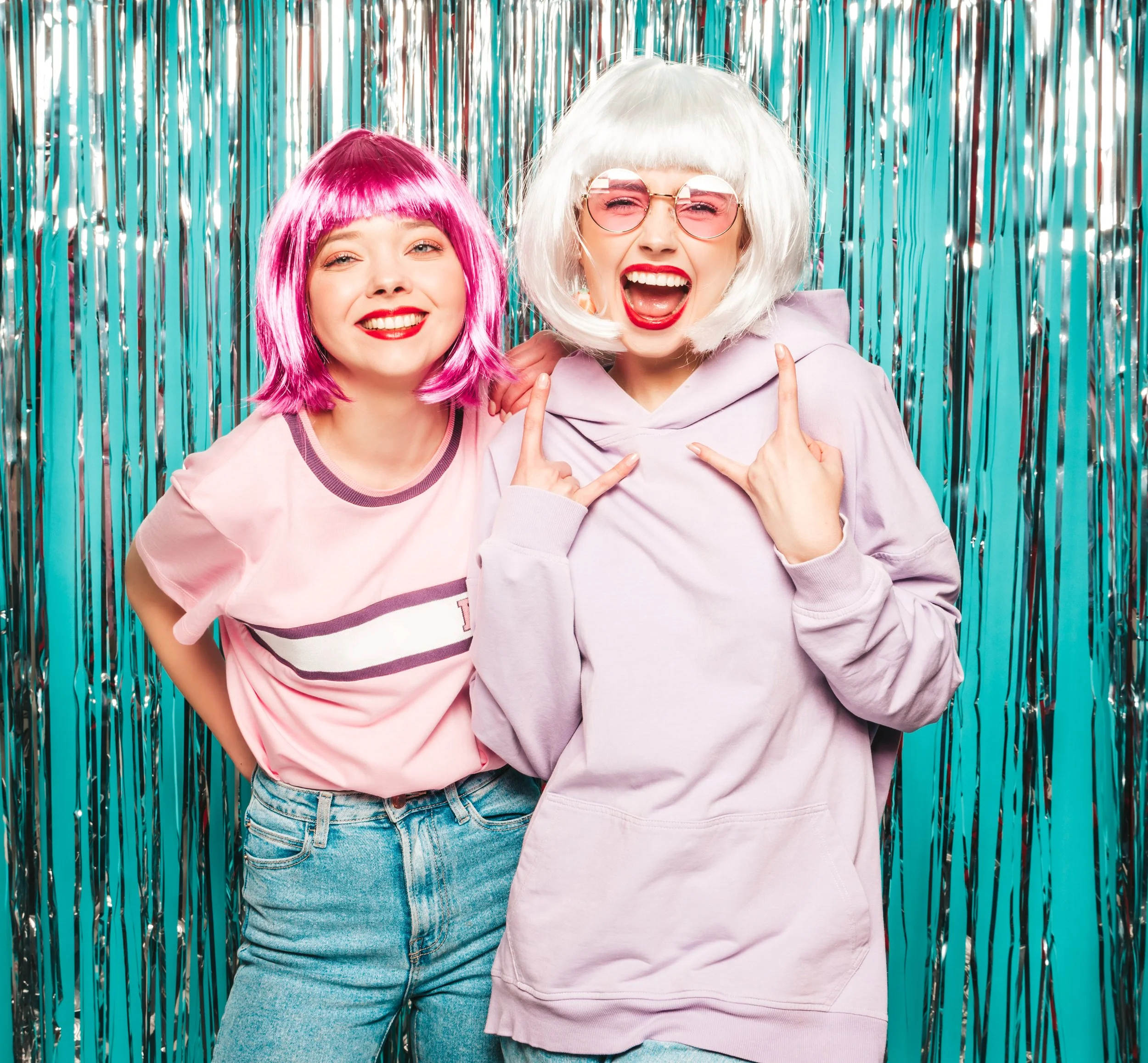 portrait-of-two-young-funny-women-posing-in-studio-2023-11-27-05-11-28-utc.jpg