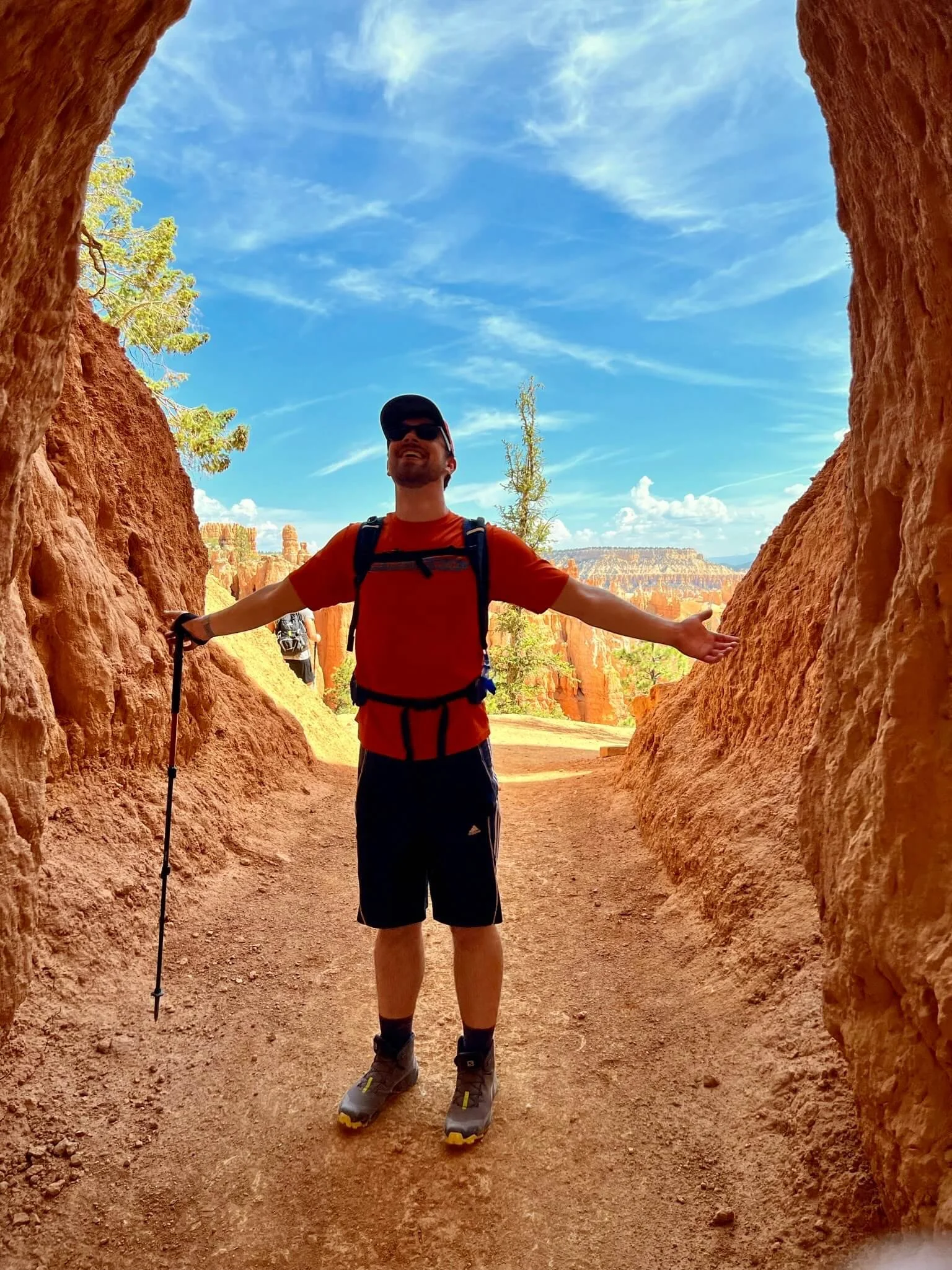 Image of therapist Jay Bachmann enjoying his mental health while hiking amidst tent rocks.