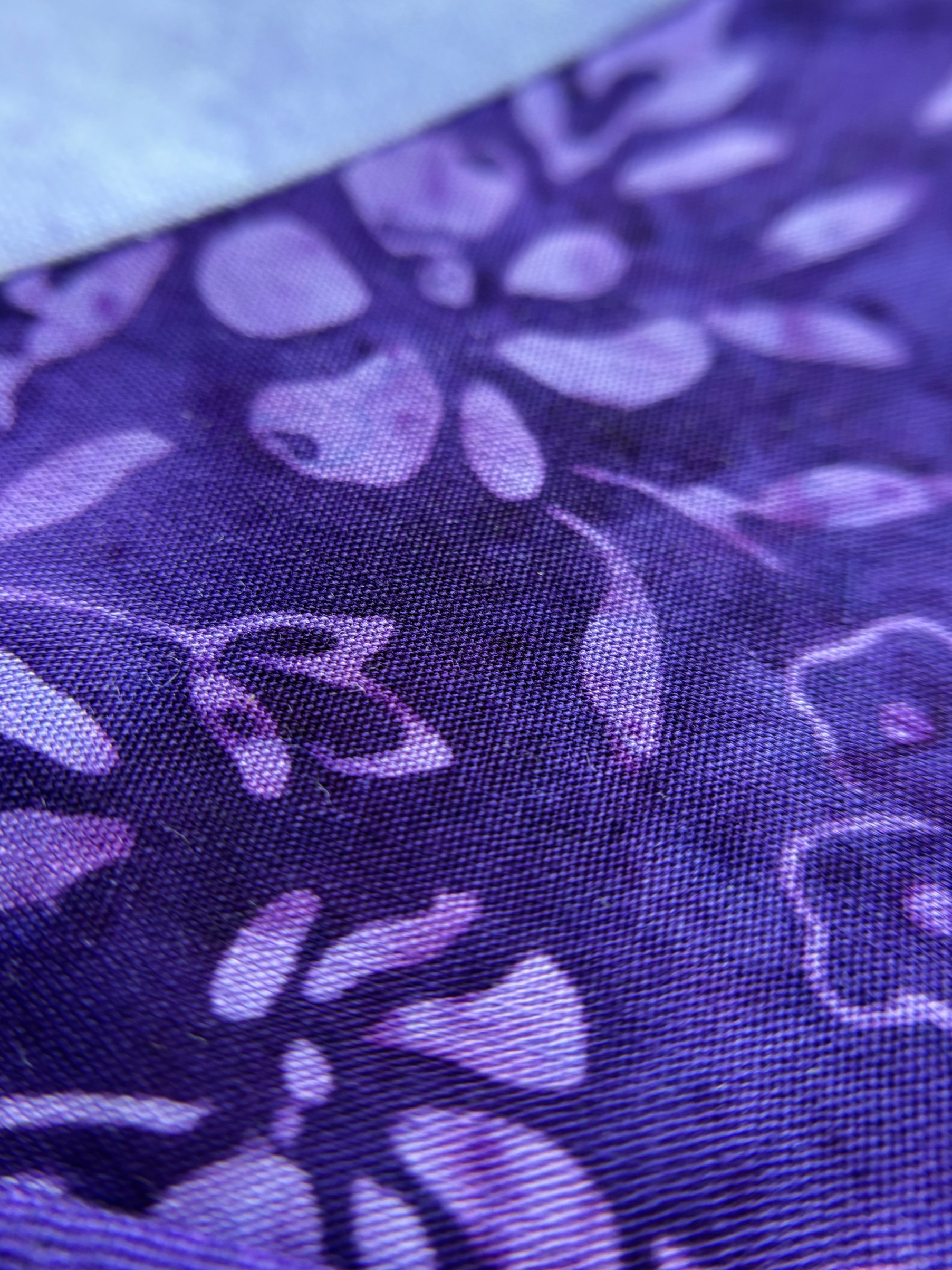 Close up on the Purple flower fabric stitching