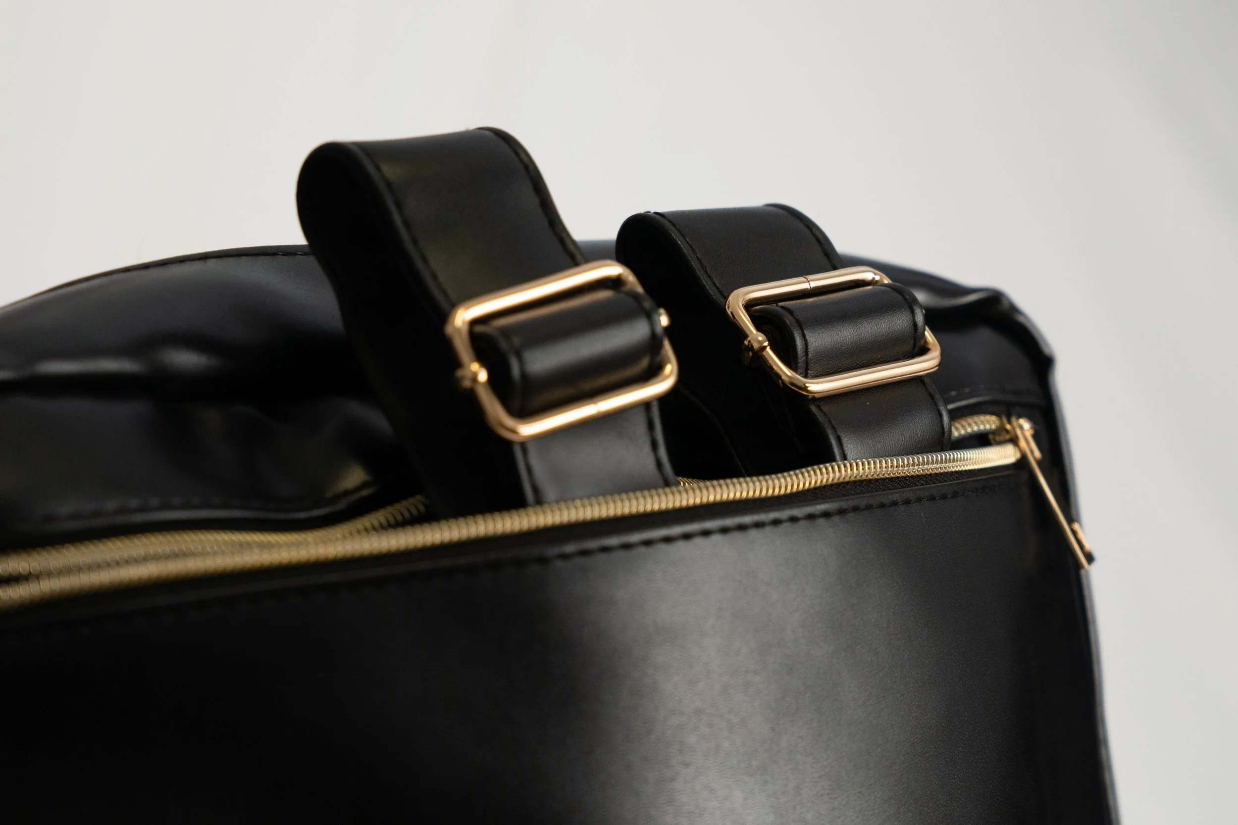 Accessory product photography in San Francisco. Backpack / briefcase closeup from Young Professionals on white background.