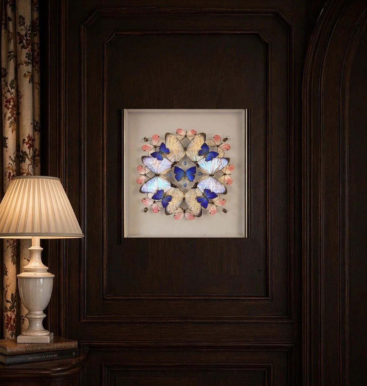 A drift of mother-of-pearl morphos, deep iridescent blue hairstreaks, and soft pink phantom blush butterflies&mdash;casting quiet light across a dark wood-paneled room.

&mdash;

#HomeDecor #InteriorDesign #LuxuryInteriors #MoodyInteriors #DesignInsp
