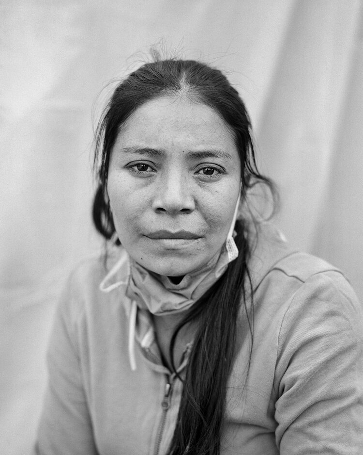 11. Doris Lara, 31, from Honduras, at Enrique Romero Municipal Gymnasium in Ciudad Juárez, Mexico. Photograph by Doris Lara and Adam Ferguson.