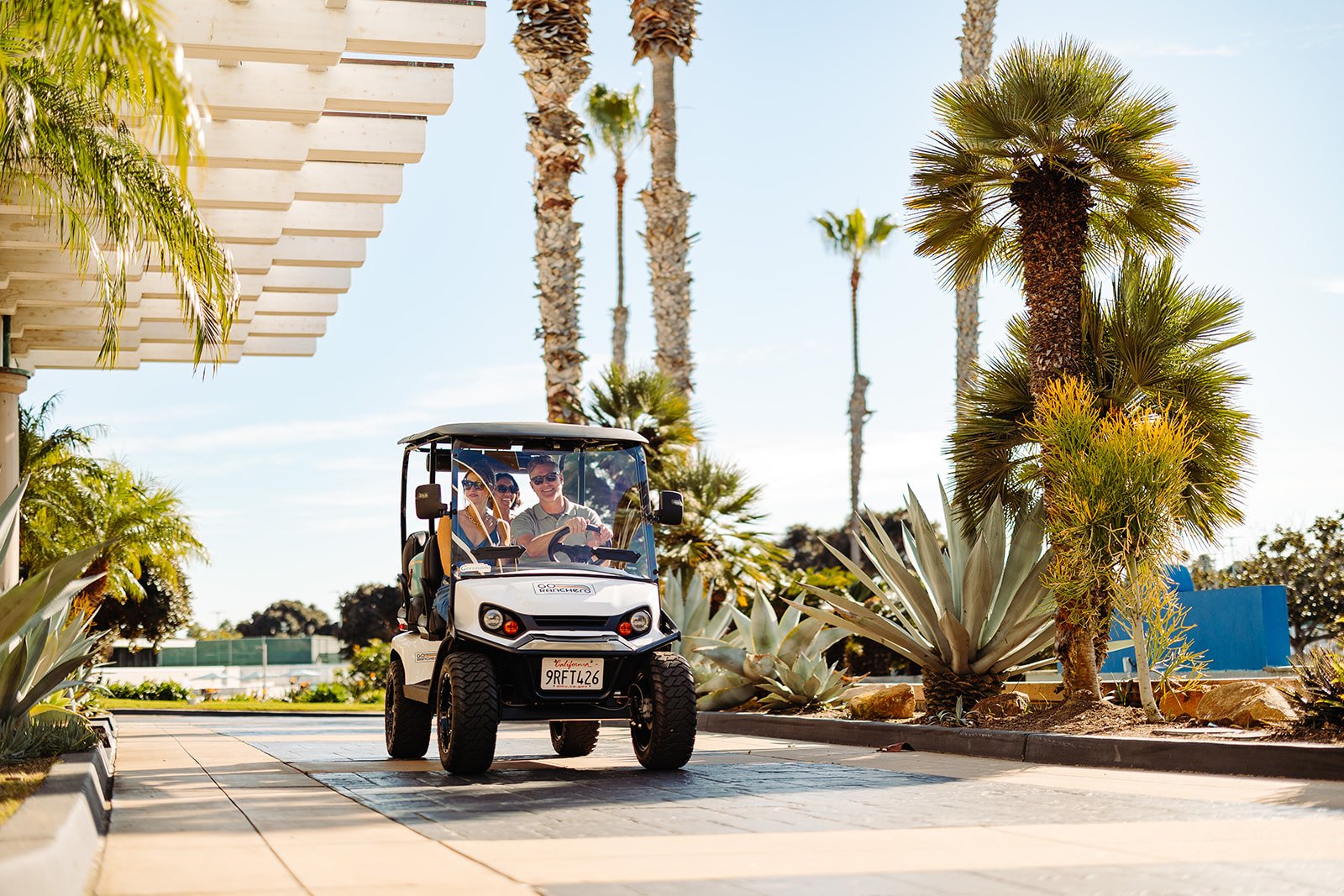 Go Ranchero street-legal golf cart with passengers at the Coronado Island Marriott valet