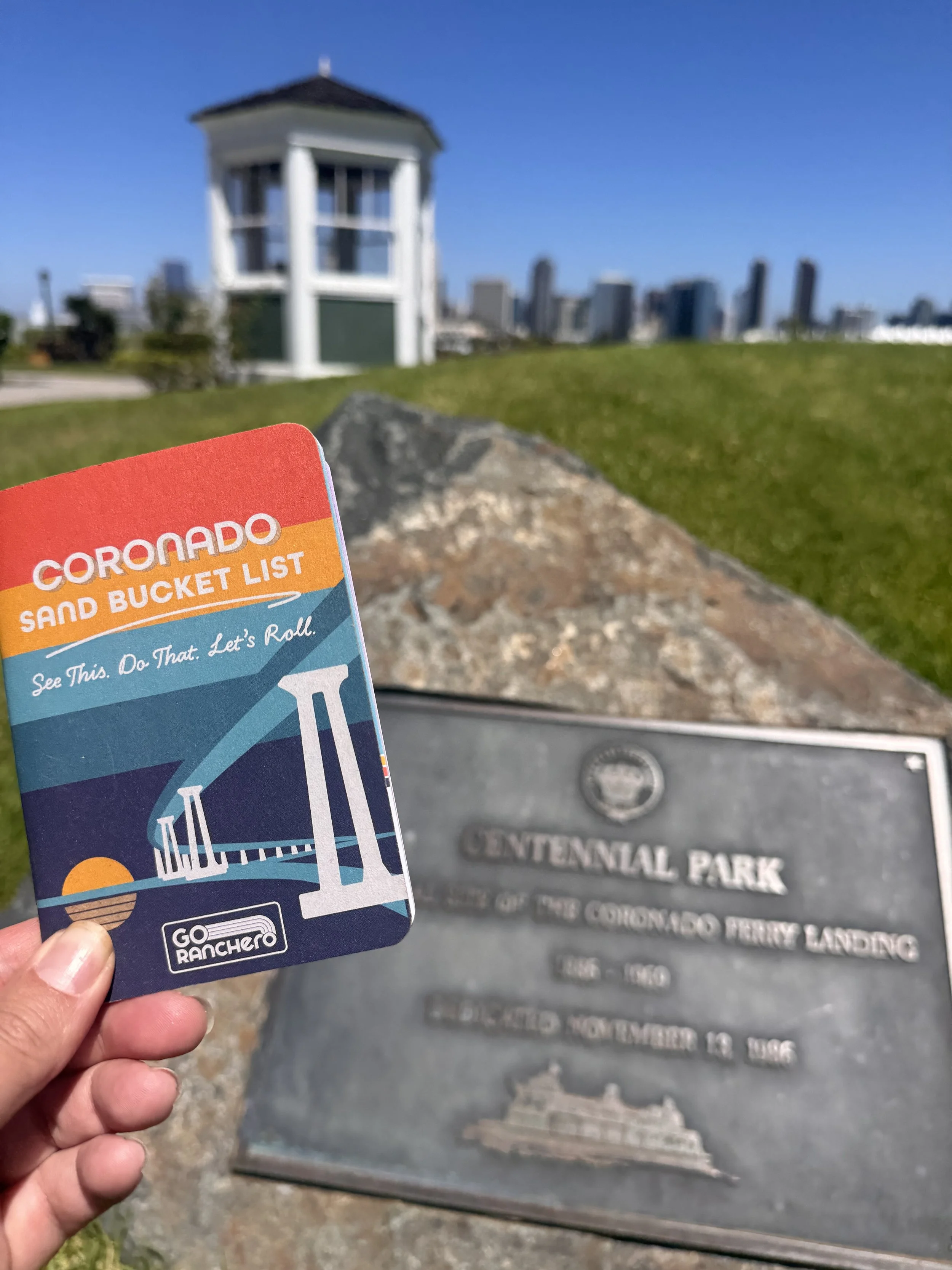 Coronado Sand Bucket List at Centennial Park with the San Diego skyline in the background