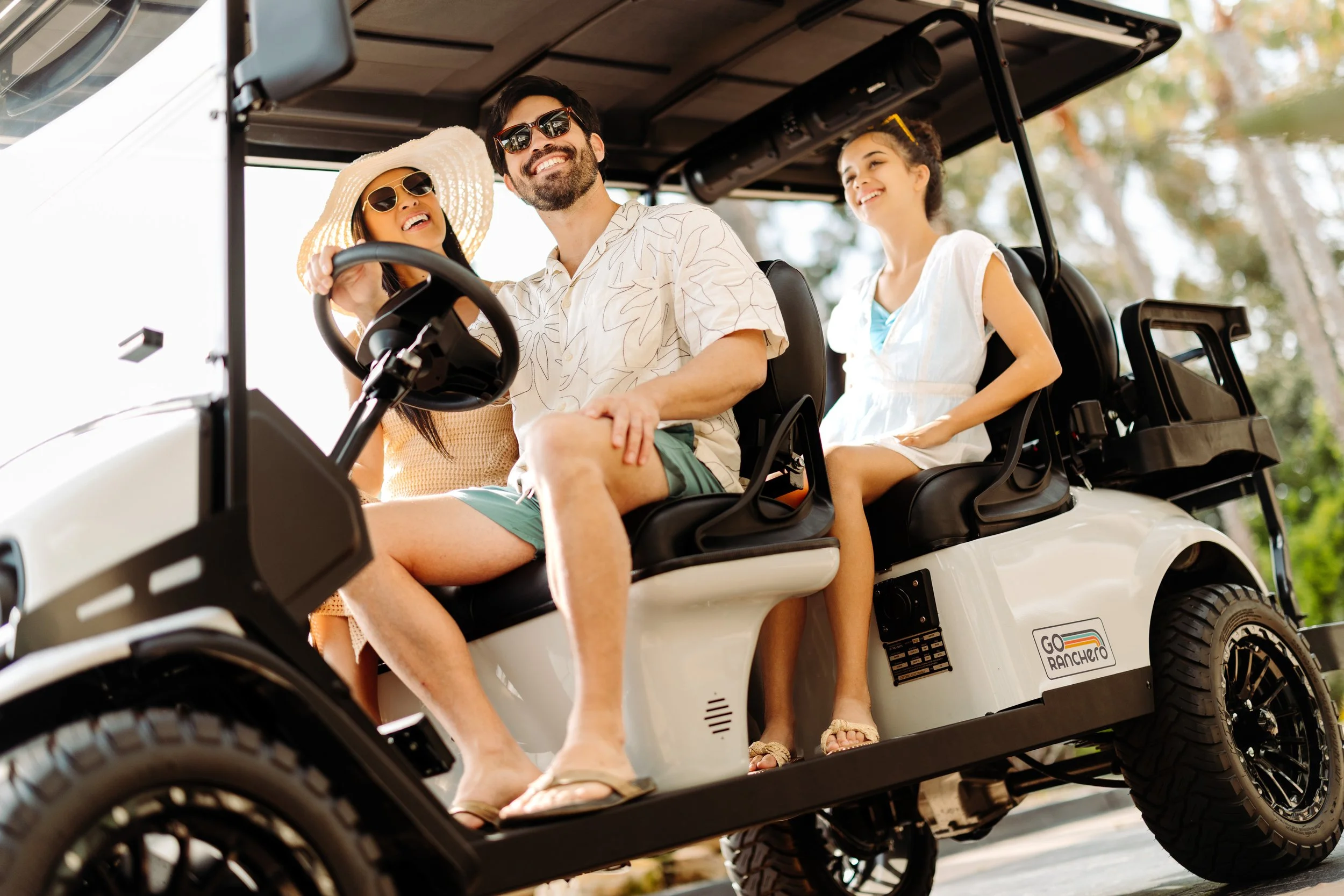 Go Ranchero 6-passenger E-Z-GO Express golf cart with passengers in Coronado, California