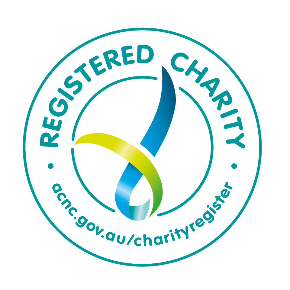 Charity registration seal with a stylized ribbon in blue, green, and yellow, and the text 'REGISTERED CHARITY' encircling it; includes website URL 'ncg.gov.au/charityregister'.