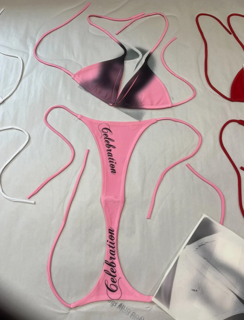 Gaussian blur print bikini top and bold celebration type on a Y2K pink base