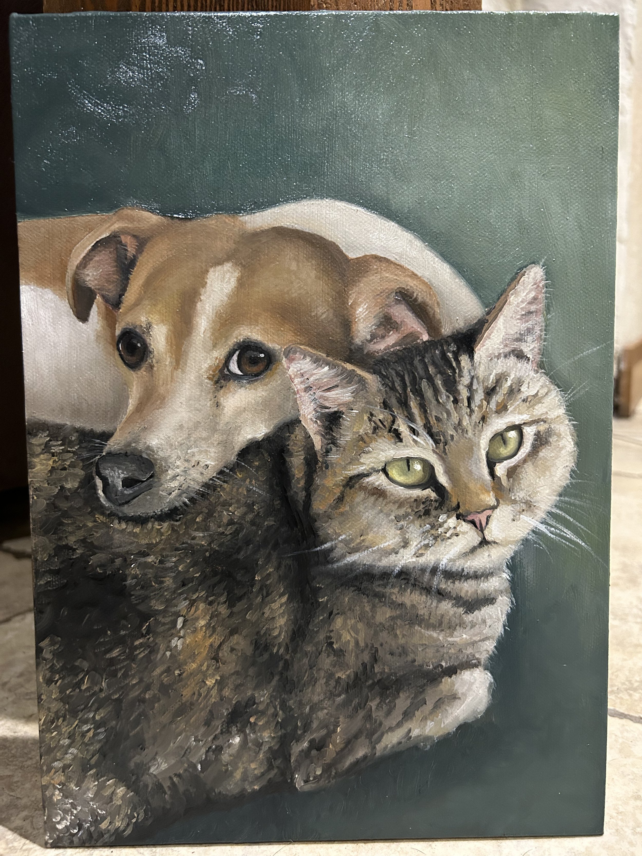 A painting of a dog and a cat lying close together on a green background.