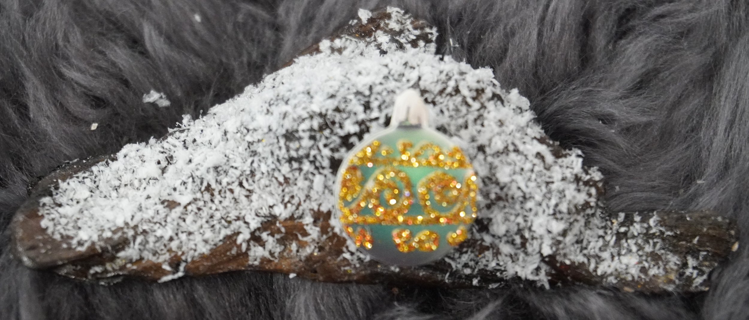 Snow-Dusted Elegance Ornamental Sphere on Driftwood