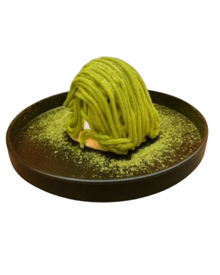 A black plate with a dessert resembling a green bundle of noodles, topped with matcha powder.